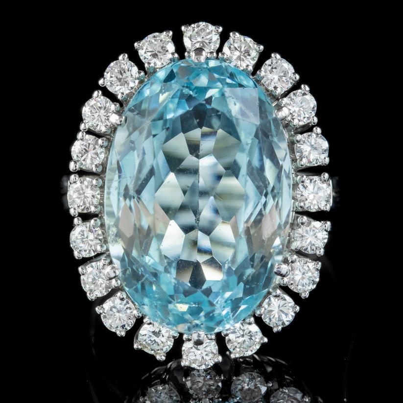 A magnificent Vintage cocktail ring adorned with a magnificent Briolette cut Aquamarine weighing approx. 13ct with a desirable clear ocean blue colour with flashes of green.

A halo of bright, clean Brilliant cut Diamonds frame the Aqua and have