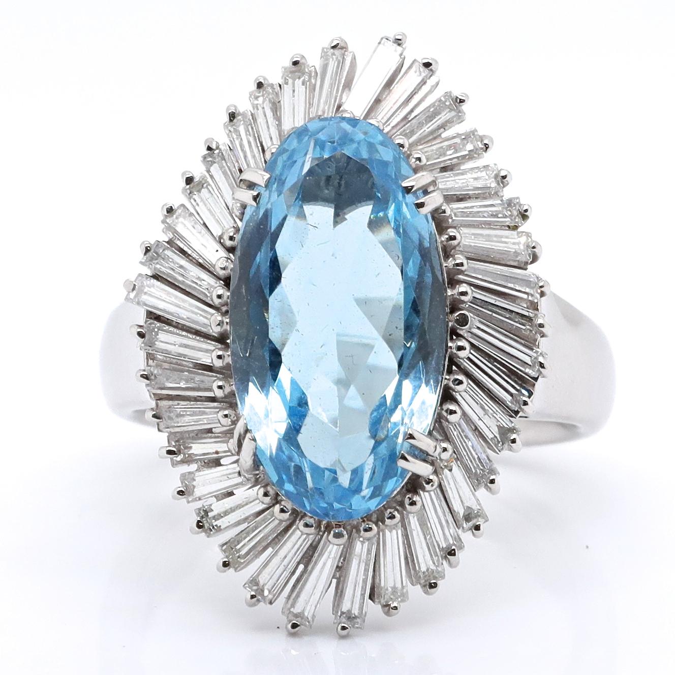 This ring is glamorous enough to be worn by a Hollywood star or a trendy newscaster. This is a desirable Vintage Aquamarine Diamond Platinum Ballerina Cluster Ring. The center stone is an Oval cut aquamarine, 6.48 carats. Accompanied by 36 tapered