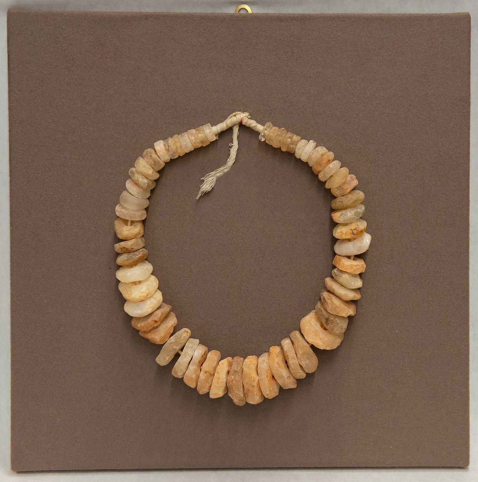 O/4907, Rough vintage necklace, mounted like a sculpture on a wooden panel (cm. 45x 45)
It is a bridal shell money or wedding dowry.
It is possible to obtain different necklaces, if You don't want to put on panel -
It is a very interesting piece for