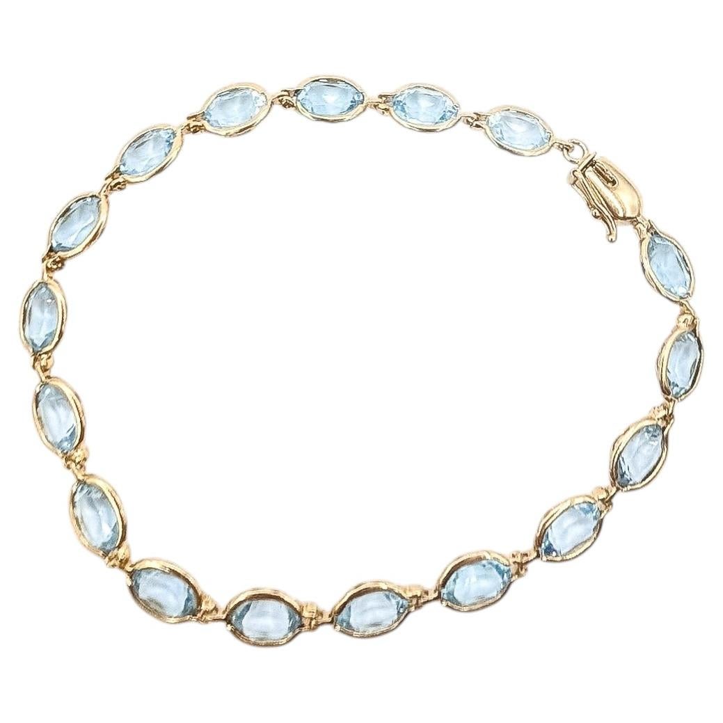 Bracciale tennis vintage con acquamarine in oro giallo 14 carati