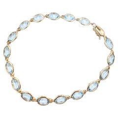 Pulsera tipo tenis vintage con aguamarinas en oro amarillo de 14 quilates