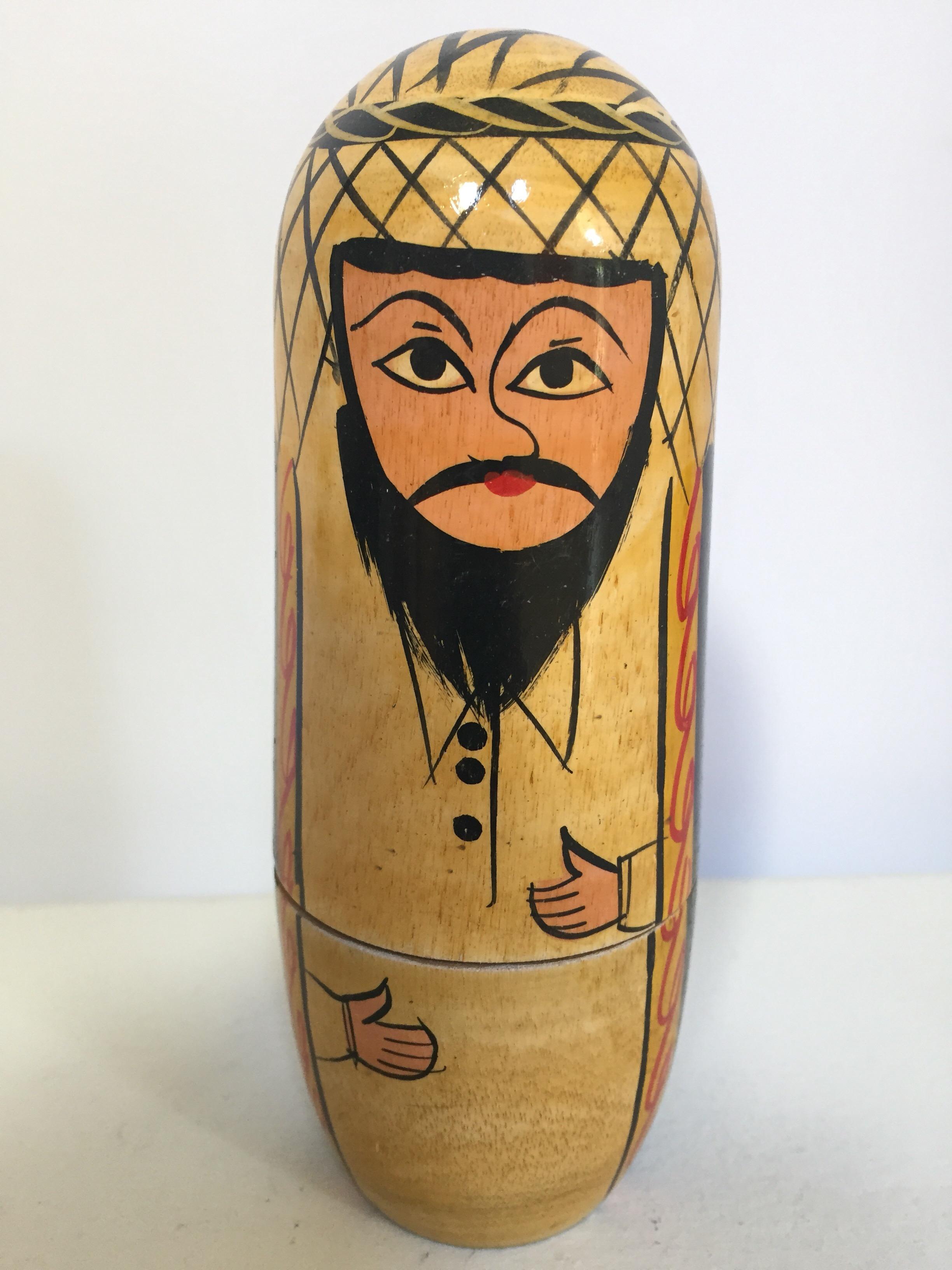 Vintage nesting dolls of an Arab Muslim family of a man in traditional costume, woman wearing head scarf and traditional robe with a girl and her baby camel pet.
Nesting of four handcrafted and hand-painted dolls.
Largest man doll is 6