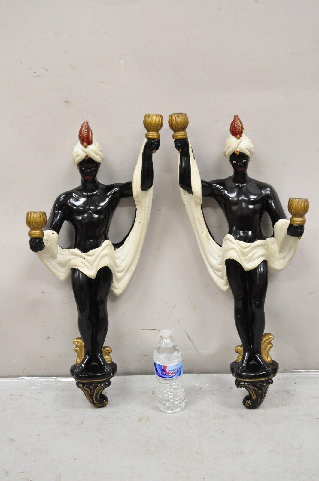 Vintage Arabian Chalkware Male Figural Wall Sconce Candlesticks - a Pair. Item featured is right and left facing, original paint, two candlesticks each, very nice vintage set. Circa Early to Mid 20th Century. Measurements: 28