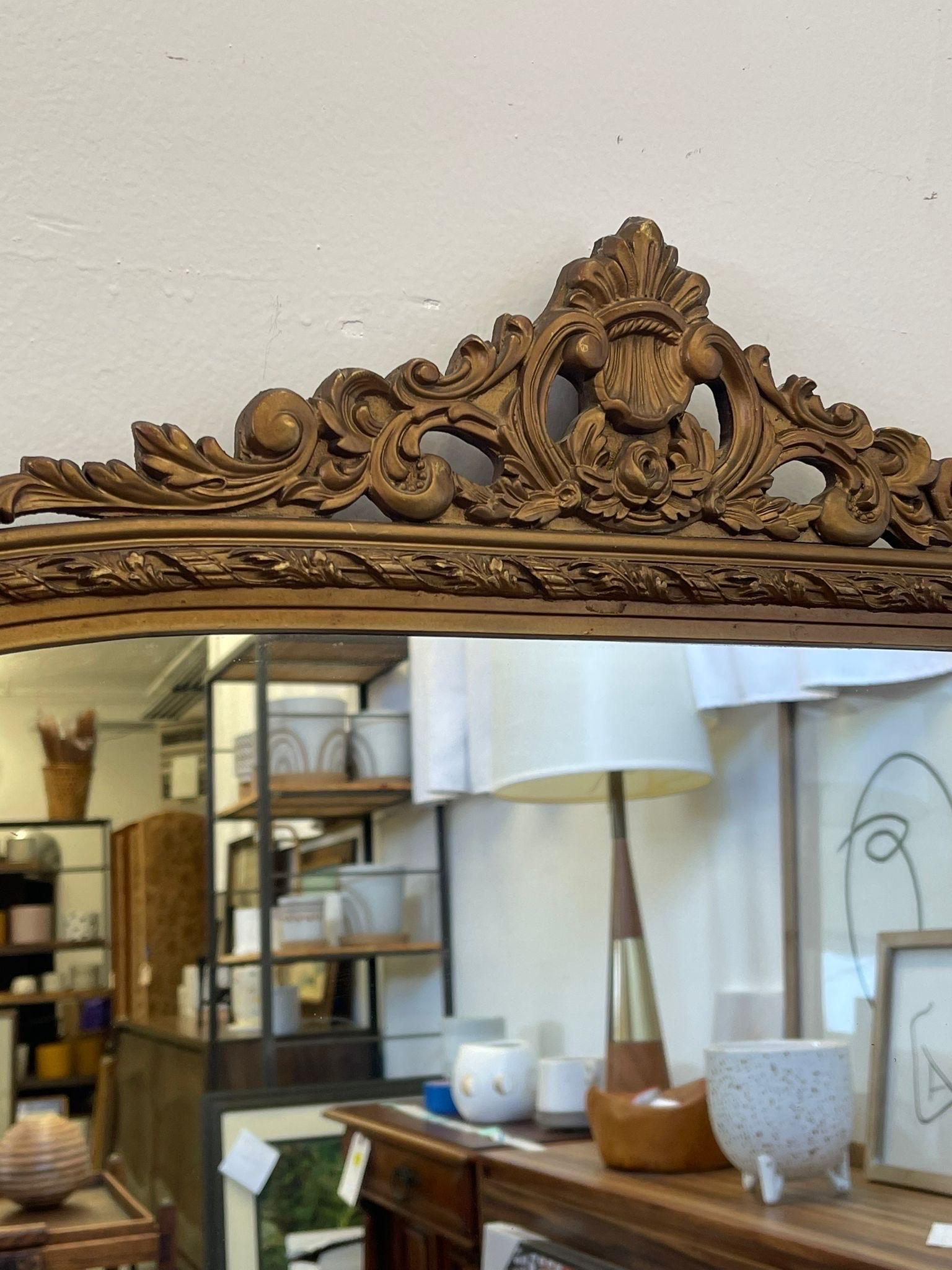 Vintage Arched Ornate Carved Gilt Wood Framed Mirror. Circa 1940s  In Good Condition For Sale In Seattle, WA