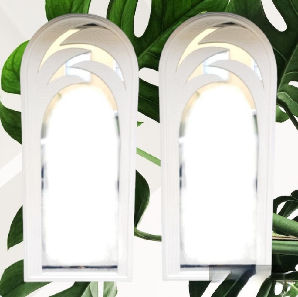 A pair of rare monumental beautiful white lacquered pencil reed tropical leaf floor mirrors.
The mirrors are massive and extremely heavy. They are very rare and to have acquired a pair is an incredible joy. They feature a beautiful curved leaf
