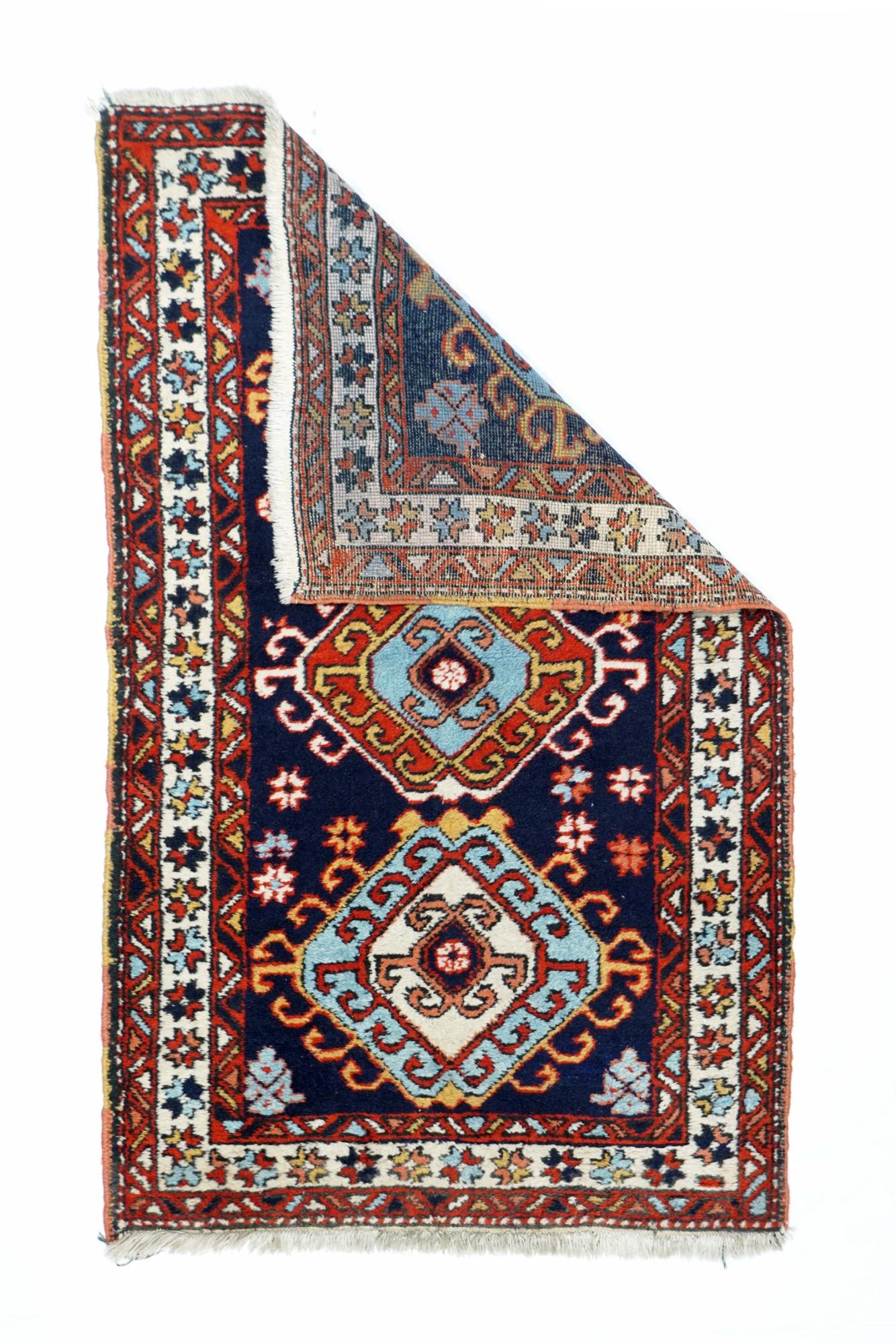 Vintage Ardebil rug 3'3'' x 4'10''. The navy field is decorated with three similar, hooked and nested octagons detailed in ecru, milky camel tan, red and pale blue. Main border of floating, polychrome stars, Triangle and diagonal bar red minors.