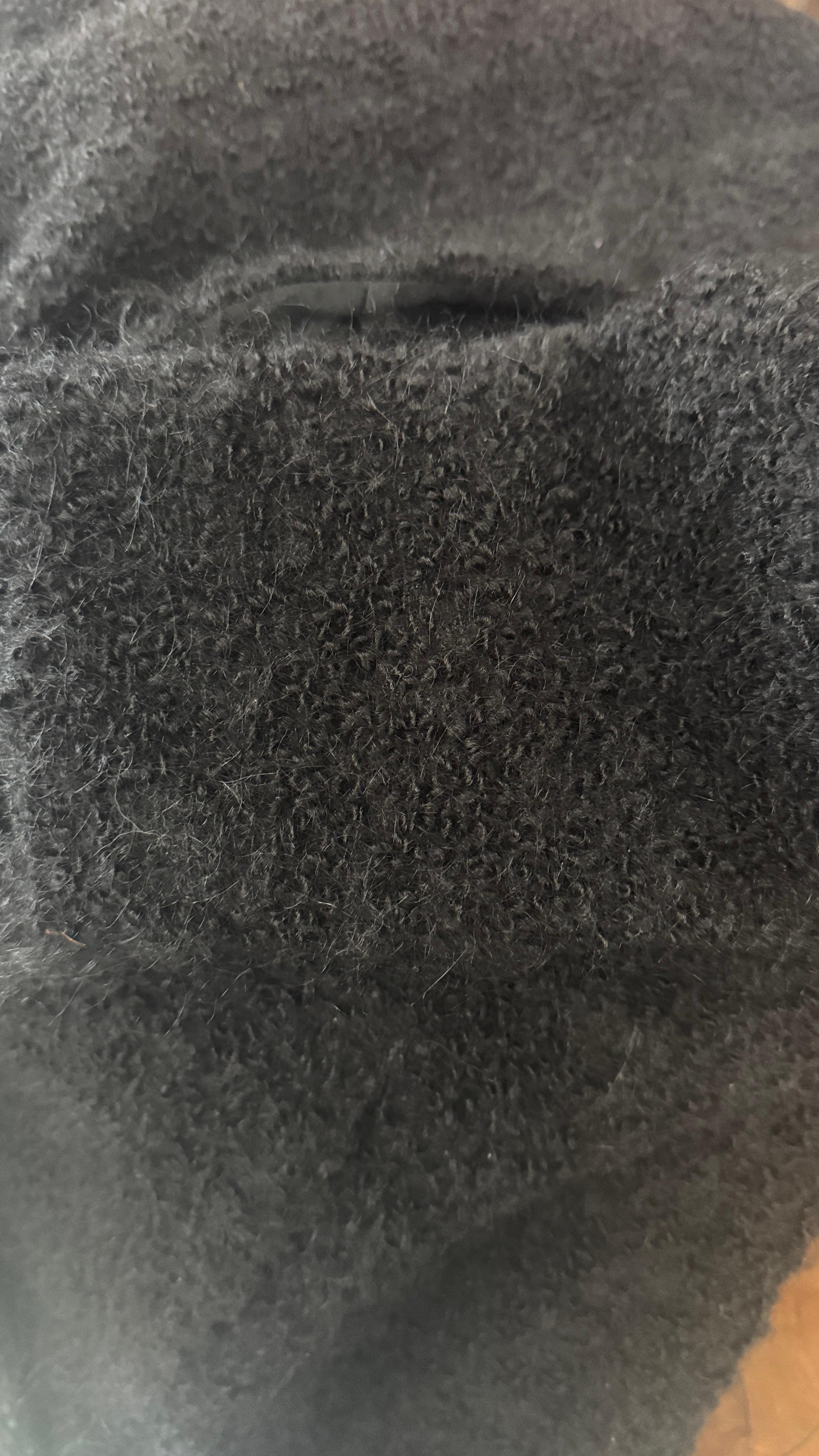 Elevate your wardrobe with this sophisticated black bouclé coat from Armani Collezioni, crafted in Italy in 2003. A perfect example of the brand’s mastery in understated elegance, this coat combines luxurious texture with minimalist tailoring.

The