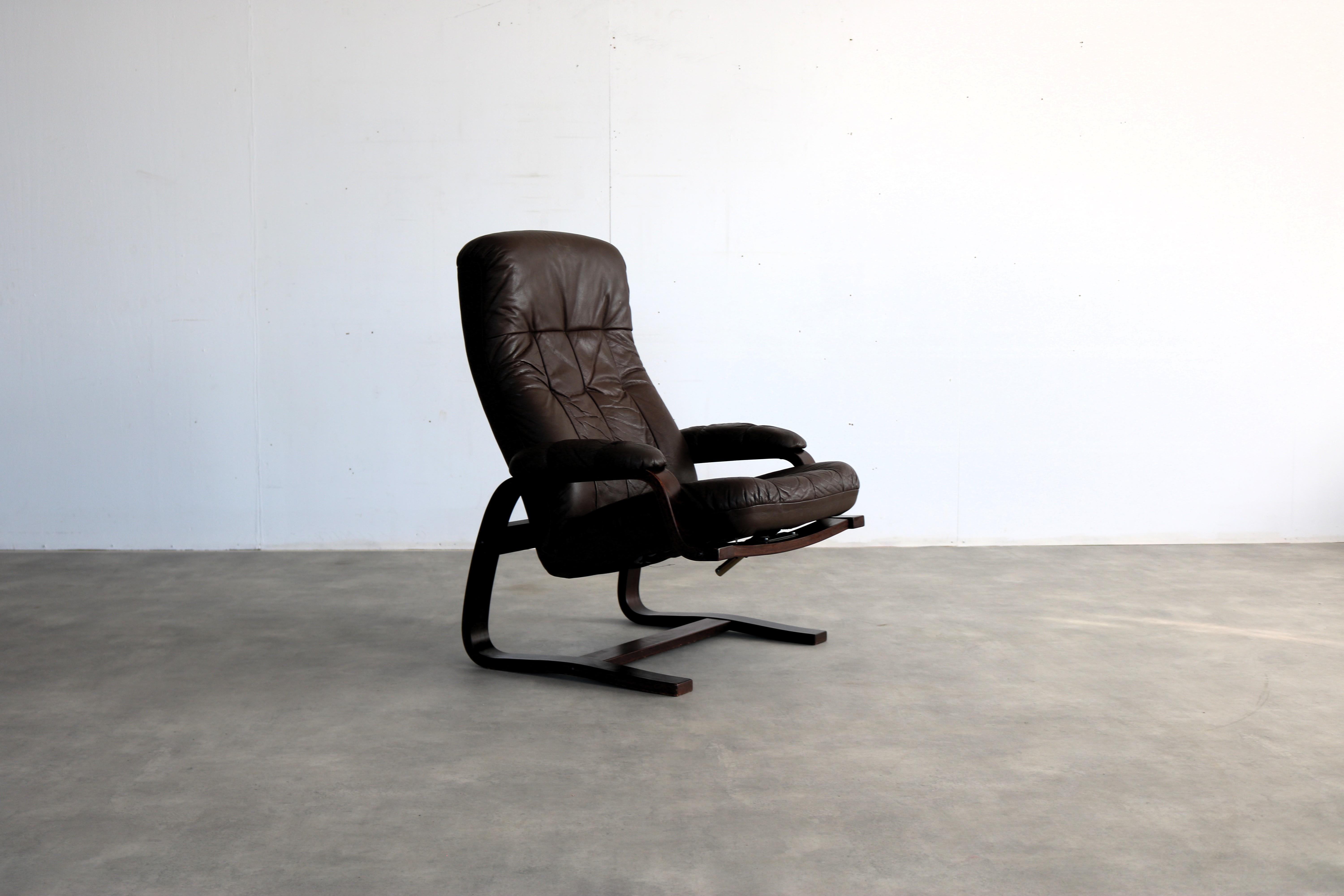 vintage armchair  armchair  adjustable  60s  Danish

period  70's
design  unknown  Sweden
condition  good  light signs of use 
size  97 x 75 x 80 (hxwxd)

details  wood; leather; adjustable;

article number  2682