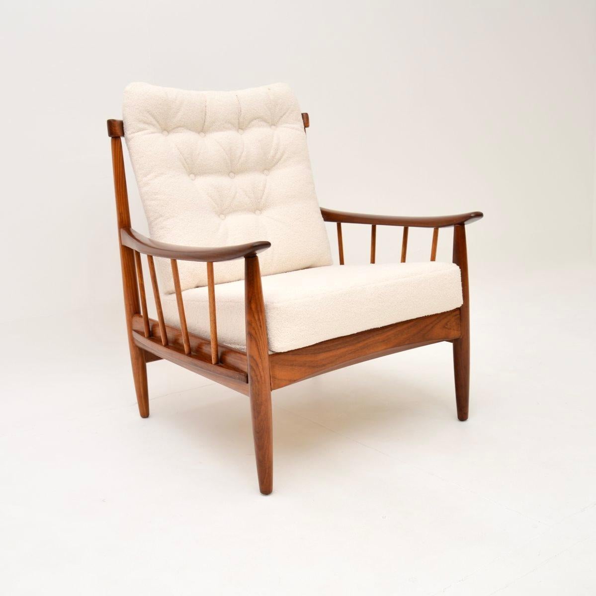 A smart and very comfortable vintage armchair by Greaves and Thomas. This was made in England, it dates from the 1960’s.

The quality is outstanding, this has a beautiful solid frame which has a gorgeous colour tone and lovely grain patterns. It