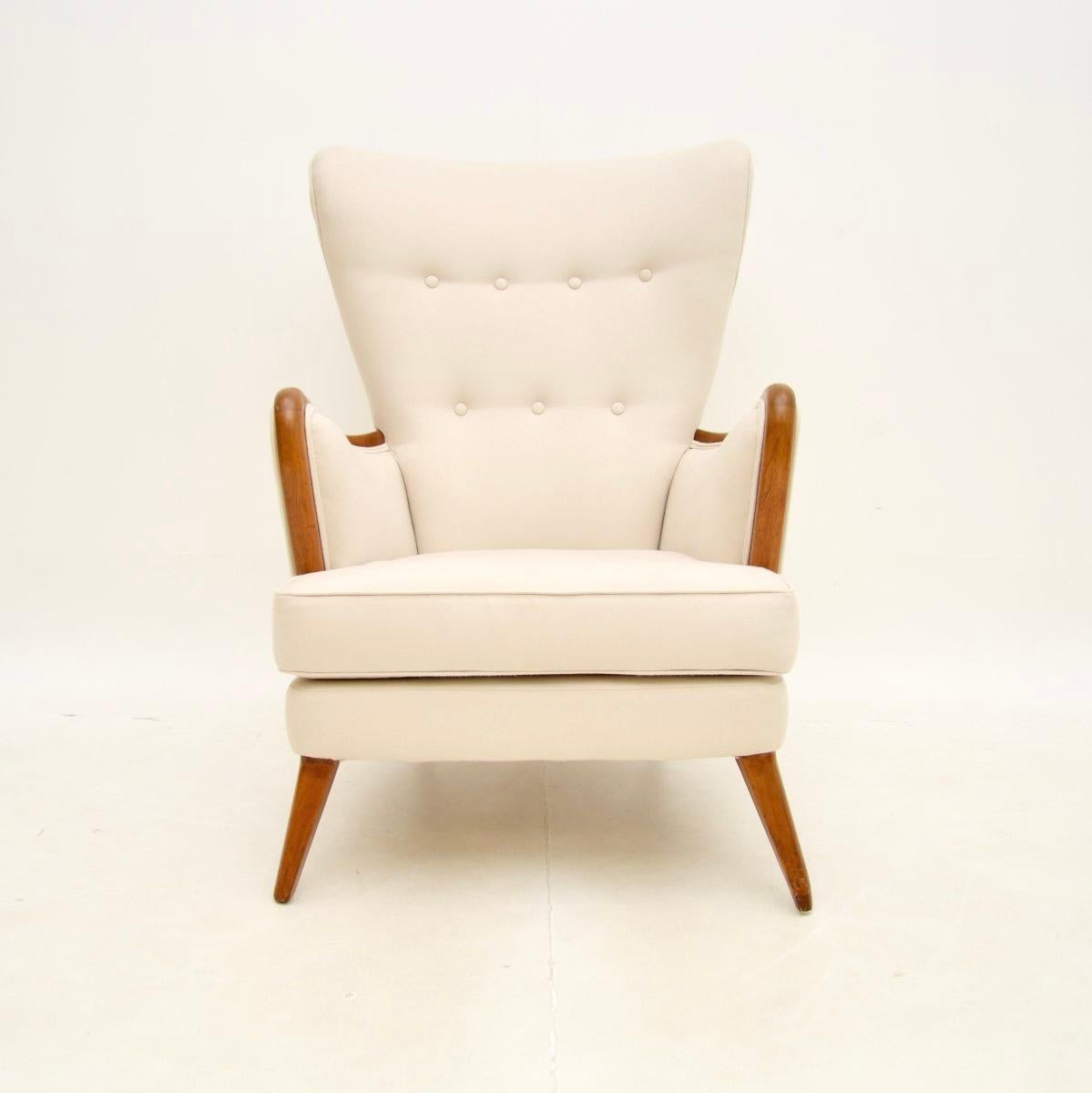 An extremely stylish and rare vintage armchair by Howard Keith. This was made in England, it dates from the 1950’s.

The quality is superb, this is beautifully designed with wonderful curves and generous proportions. It is very comfortable as well