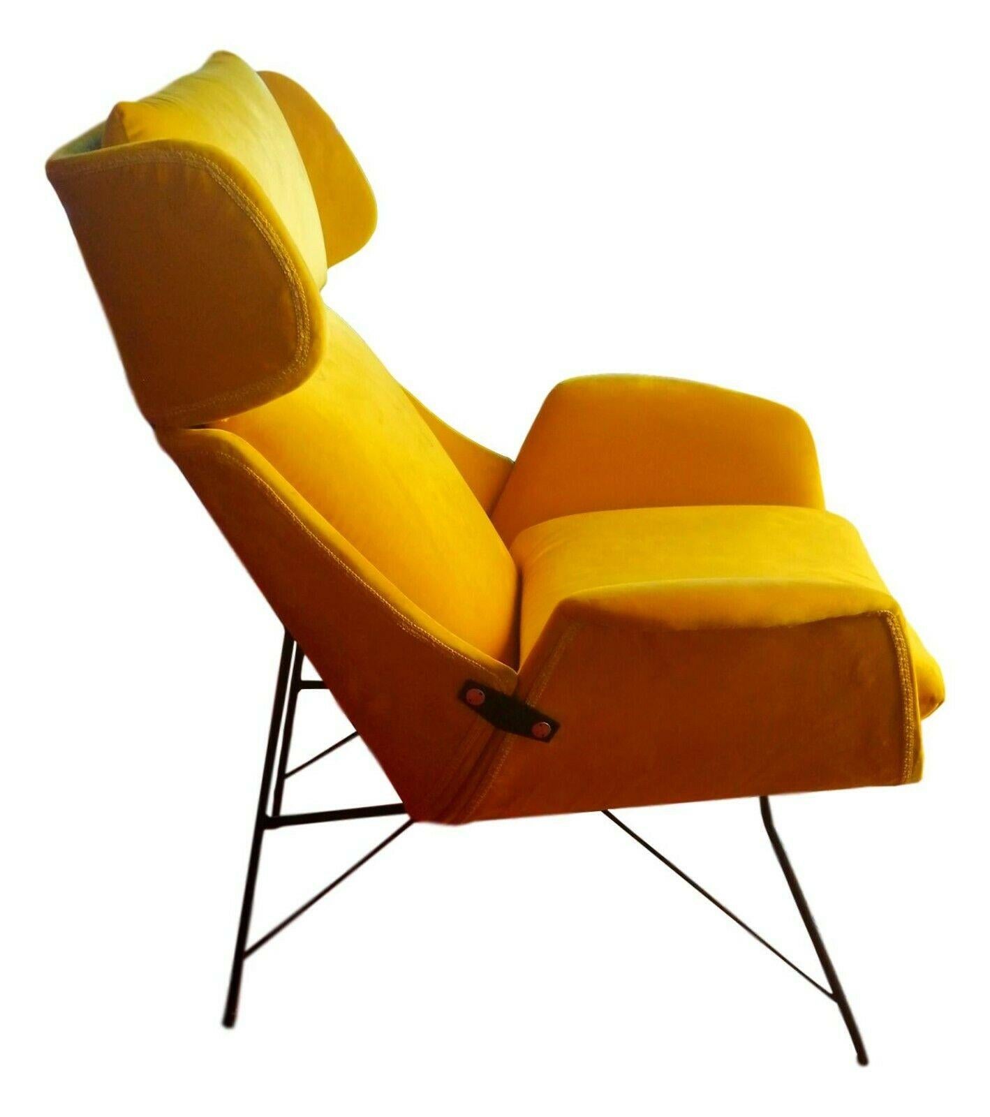 rare splendid armchair designed by Augusto Bozzi for saporiti , early 1950s.

three-section curved plywood structure on black lacquered metal frame

foam padding and cushions, yellow velvet upholstery

it measures just under 110 cm in height,
