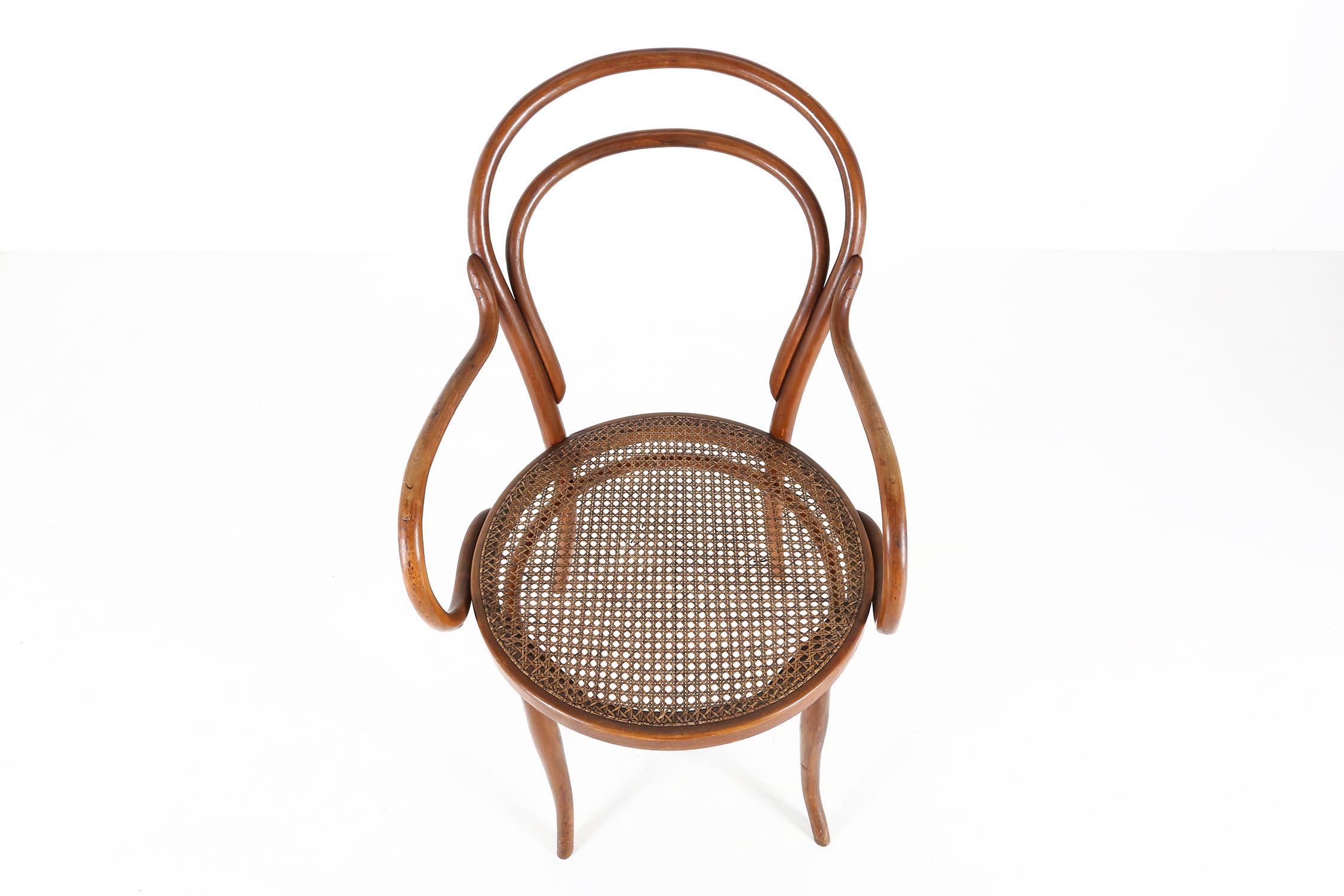 France / 1950 / chair / wood, cane / Art Deco / Mid-Century / Vintage 

Timeless Thonet-style armchair with curved wood frame and canework seat. Designed in France in the 1950s. 

Its elegant minimalist design seamlessly blends with various interior