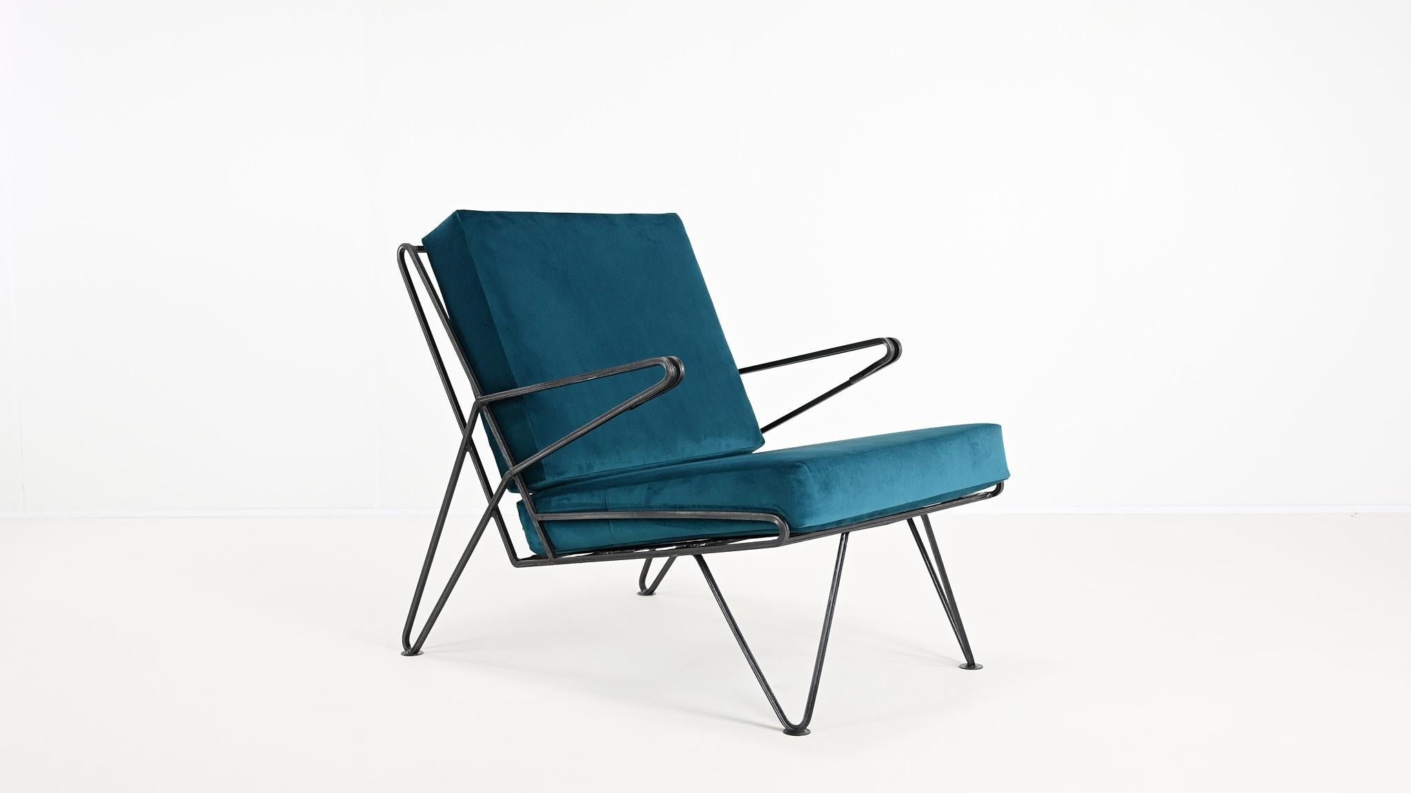 Vintage Armchair in the Manner of Maurizio Tempestini, Circa 1950

A vintage armchair, in the style of Italian designer Maurizio Tempestini, made with a sturdy yet elegant wrought iron structure that gives it durability and a clean, minimalist