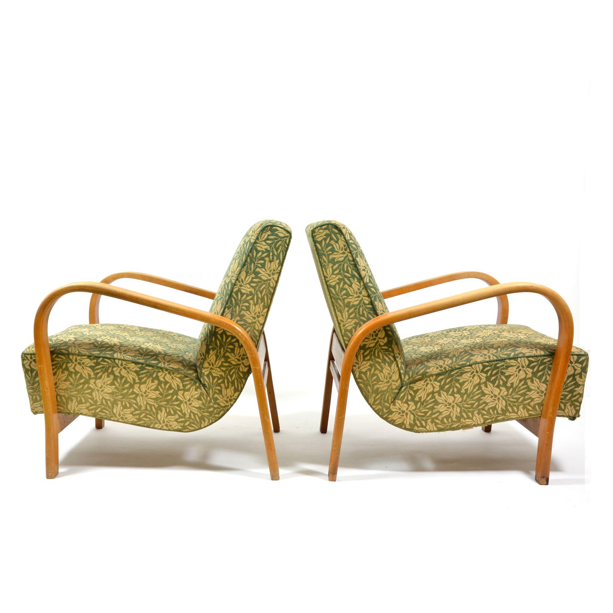 Set of two uphostered armchairs with bended beech wood armrests in light wood colour. Very nice vintage, original condition, with signs of use, but no heavy harms or instability. Uphostery fabric is also original, with green floral motive, with no