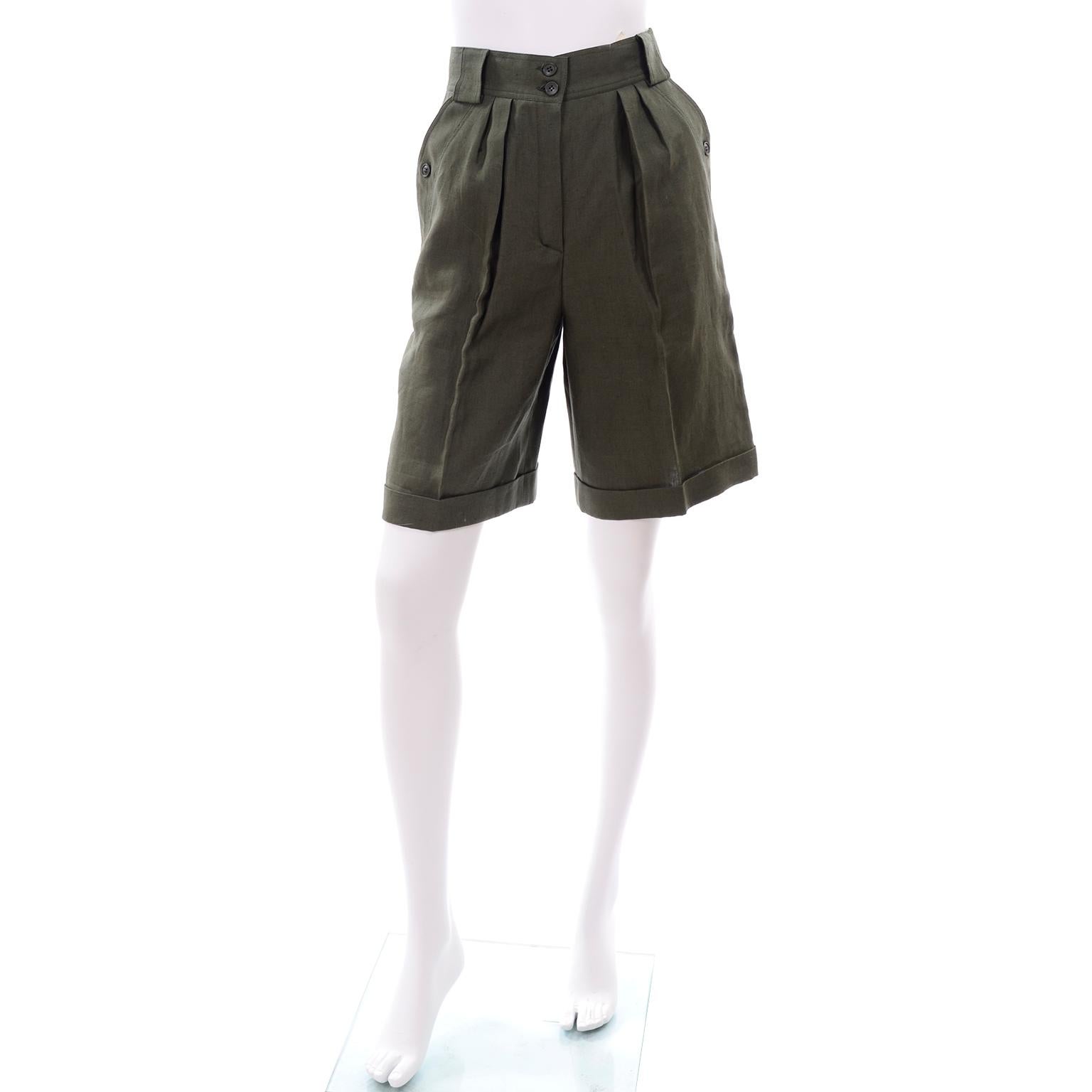 These vintage Escada high waisted vintage shorts are in an army green linen and were designed by Margaretha Ley in the 1980's. These high waisted, pleated shorts have button flap pockets at the hips and on the back.  The shorts are unlined, cuffed