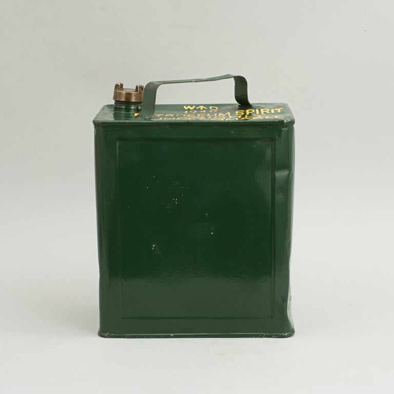 An original WWII ex-military war department 2 gallon petrol can complete with original brass screw CAP. The gasoline can has been repainted at some stage, the top with the words 'Petroleum Spirit Highly Inflammable', and 'WD, 1940' with a broad