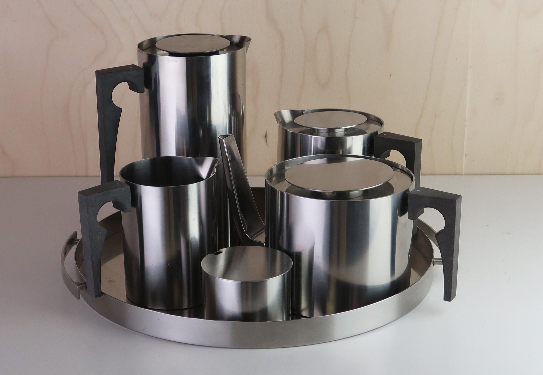 Very smart tea and coffee set on a tray

Made by Shelton,Denmark.

Designed by Arne Jacobsen

Makers marks on the base of most of the pieces. Printed label on the base of the tray

Free UK shipping







