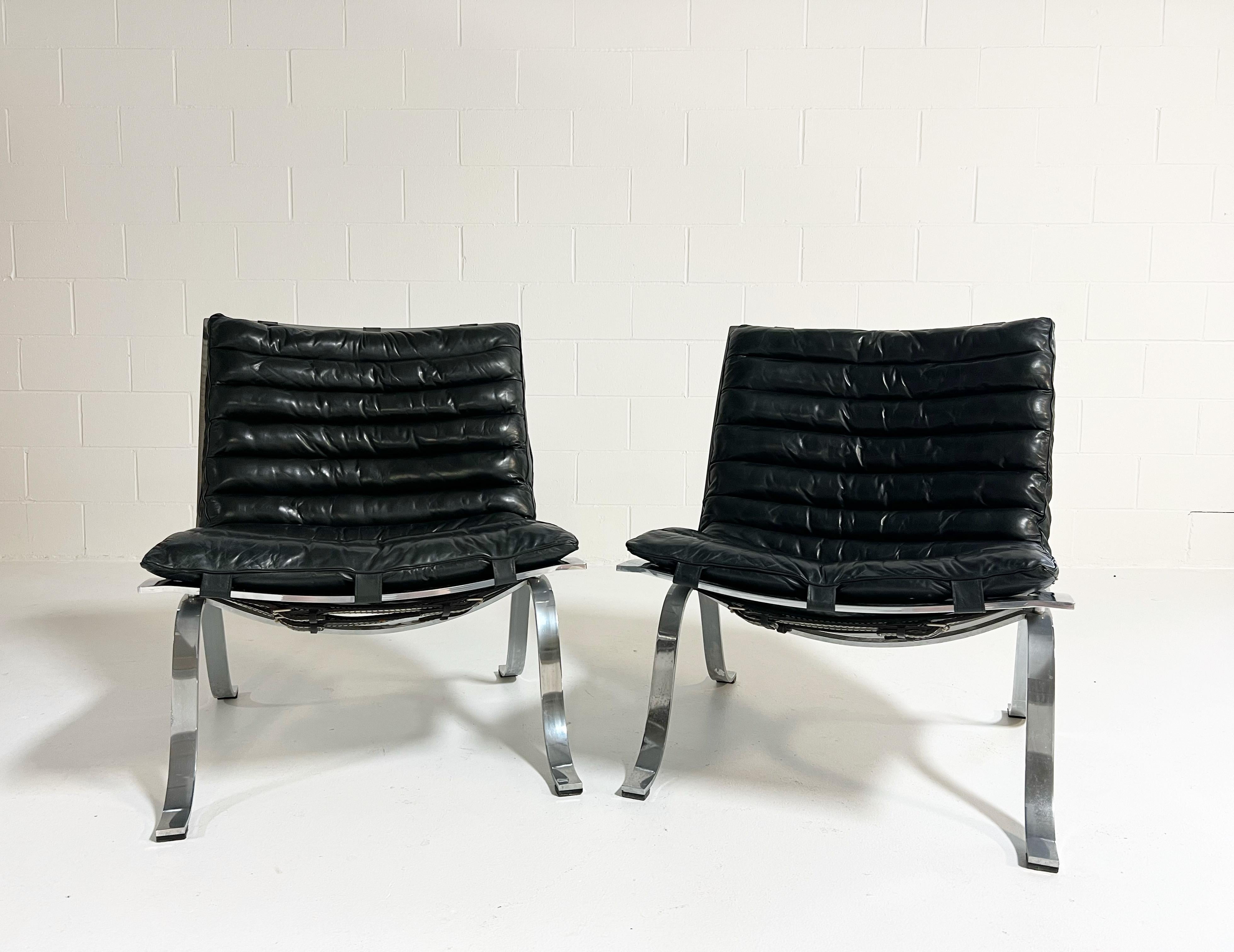 This is a rare and early pair of the Ariet lounge chair. Arne Norell's most famous design comprising of a chrome frame, leather belts and buffalo leather channeled cushion. Nothin better than chrome and black and leather. 

Manufacturer
Norell