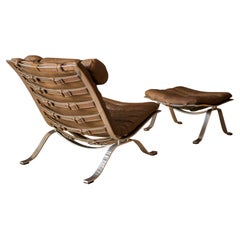 Arne Norell fauteuil de salon et repose-pieds Ari vintage en cuir et chrome