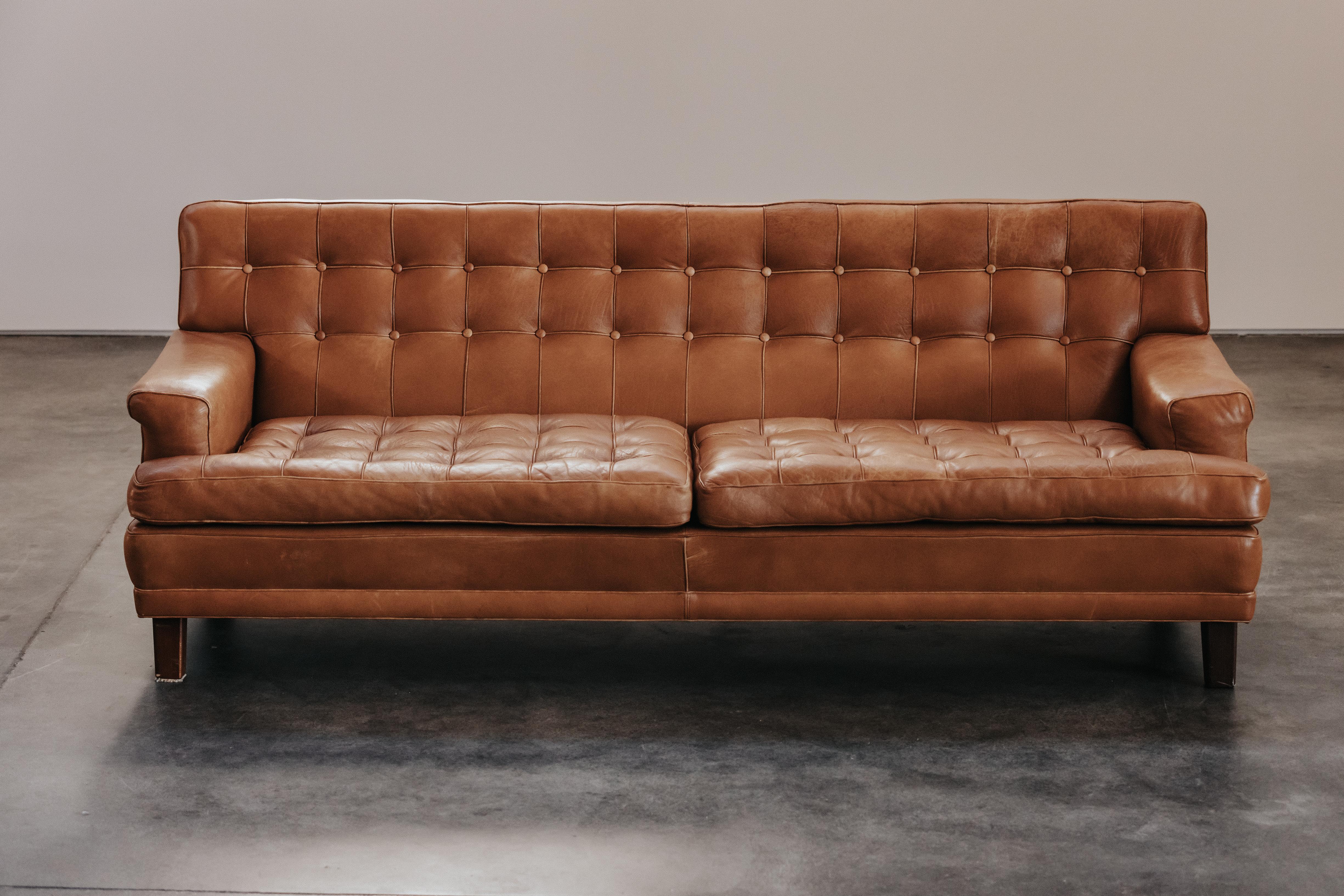 Vintage Arne Norell Leather Sofa, Model Merker, From Sweden Circa 1970.  Original cognac leather upholstery with nice patina and use.
