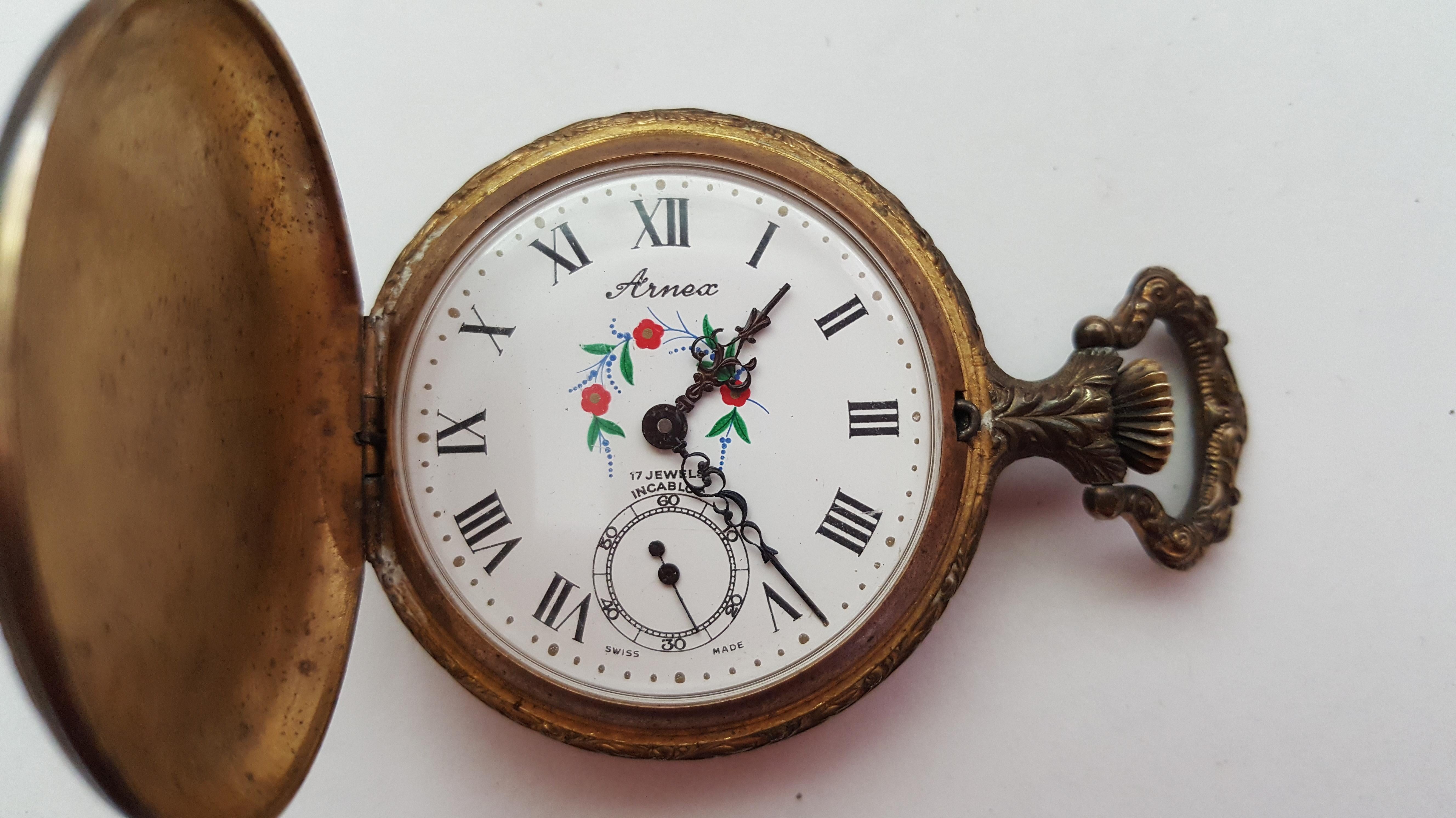 Vintage Arnex Pocket Watch, Swiss Movement, 17 Jewel, 46mm Design Case, Floral White Case Incabloc, Screwback Case, Black Roman Numerals.


Currently this watch is not working. The movement looks clean. This watch has not been serviced with a