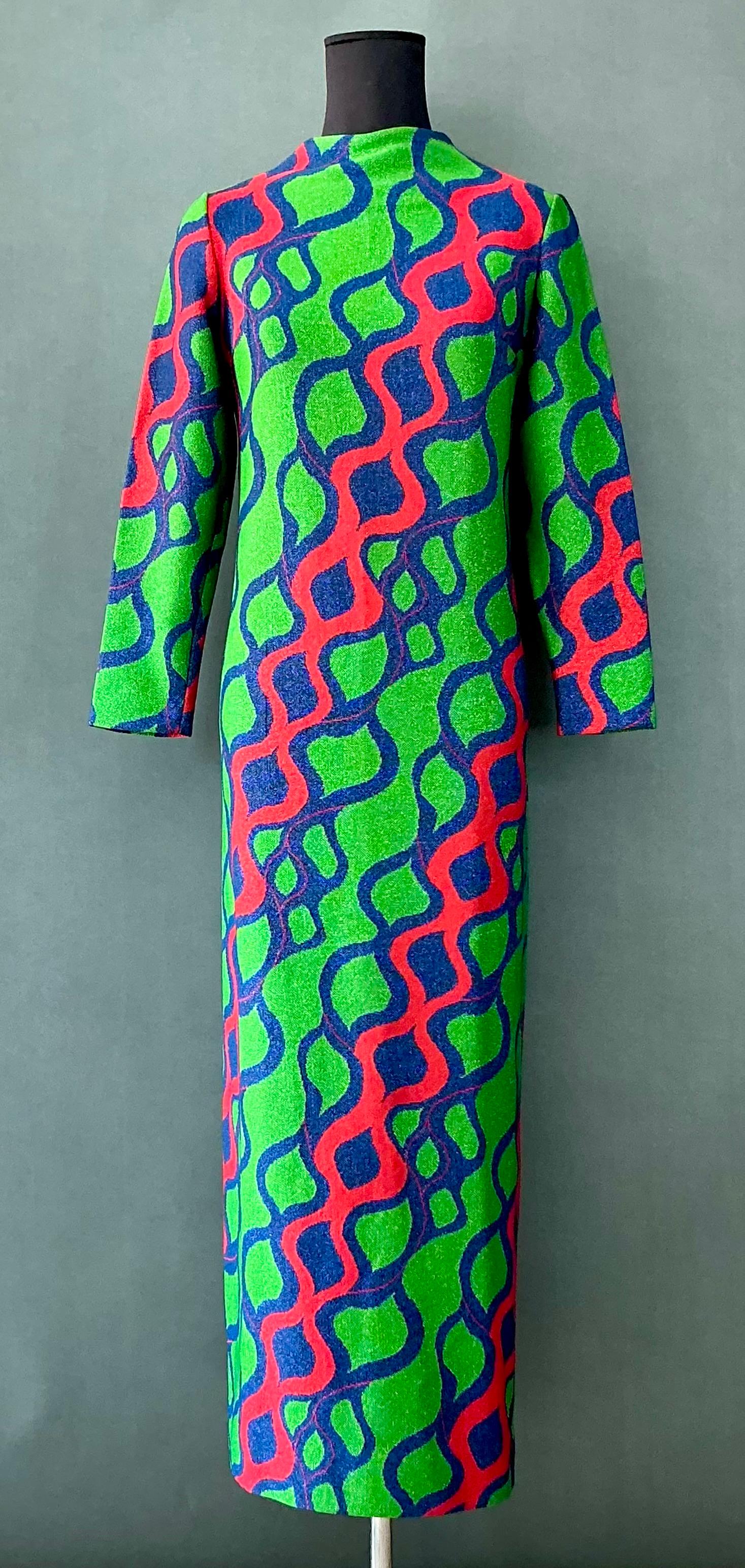 This Vintage Arnold Scaasi Lurex Knit Dress is an exquisite, show-stopping piece that exudes luxury, elegance, and timeless glamour. With its bold patterns, rich fabrics, and flattering silhouette, it’s a dress that makes a statement at any formal