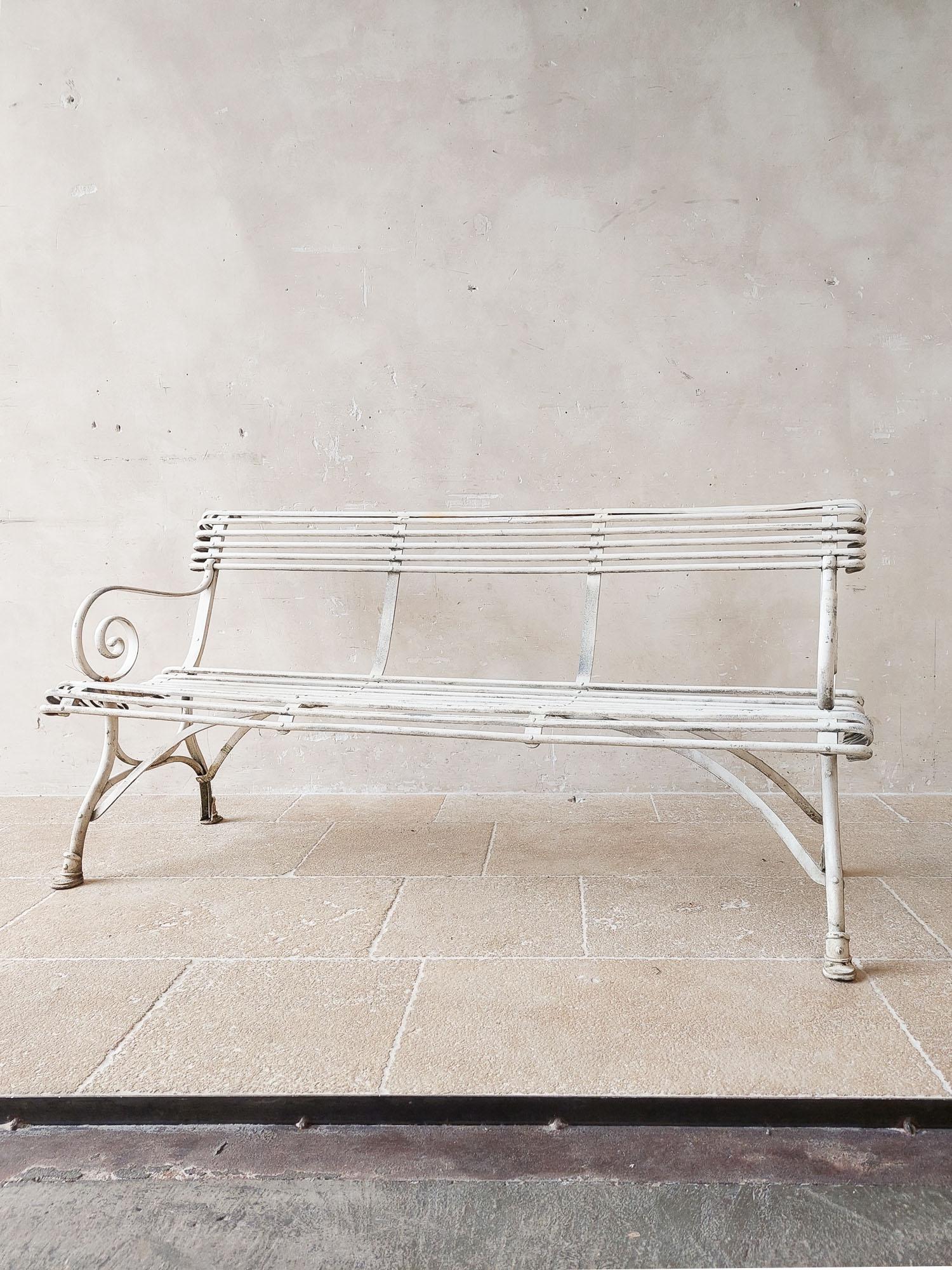 Vintage Arras style garden bench with white patina and horse hooves as feet. 


h 80 x 162 x 54 cm
seat height 42 cm