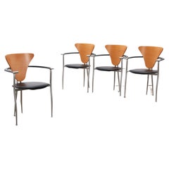 Used Arrben Italy dining room chairs, black leather with leather armrests.