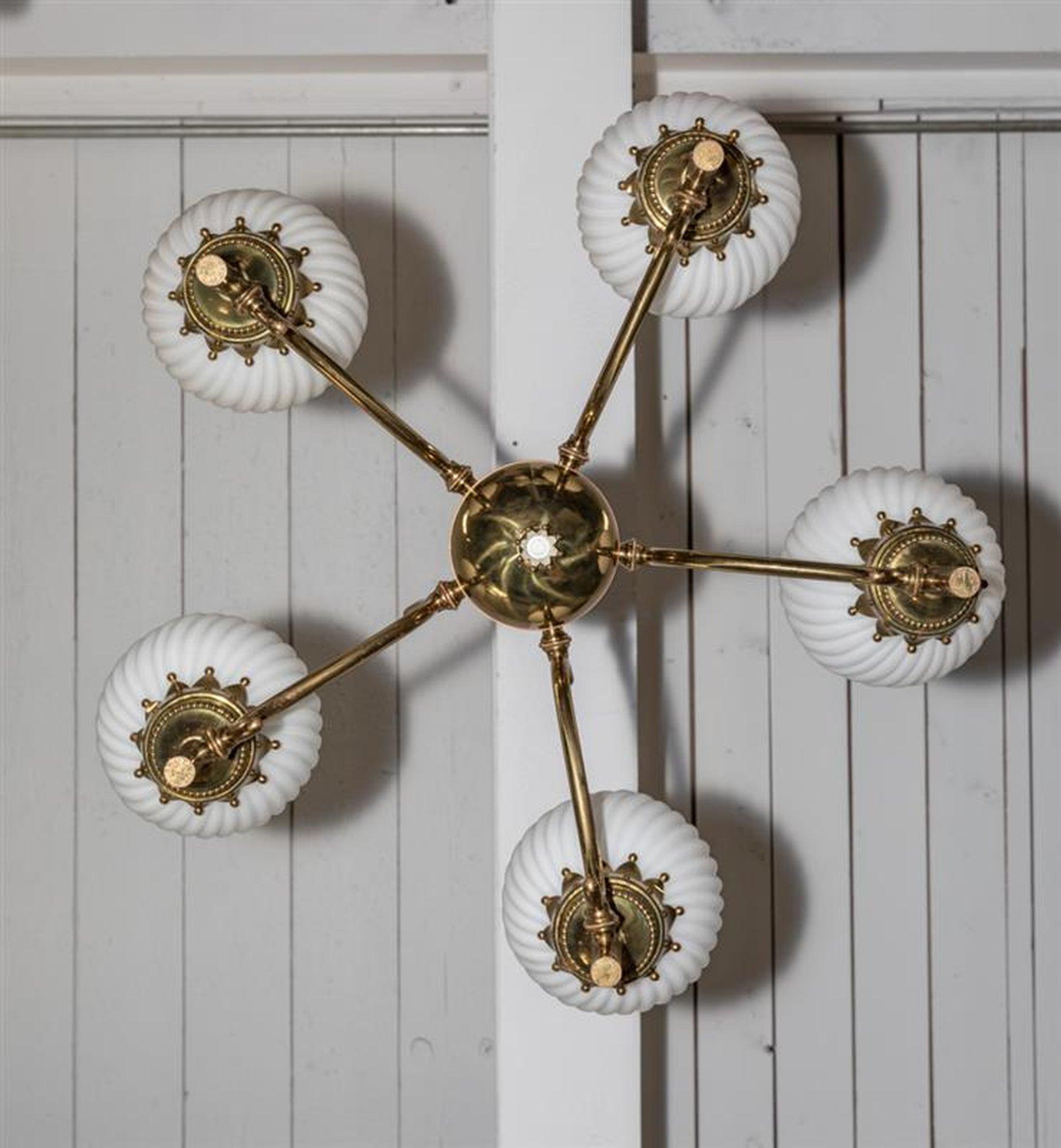 Vintage original Italian chandelier designed by Angelo Lelli for Arredoluce
Model Tortiglioni
Brass structure with 5 satin finish spiral glass shades  diffusers. Standard light sockets. Original patina on brass, not polished.

Literature: Arredoluce