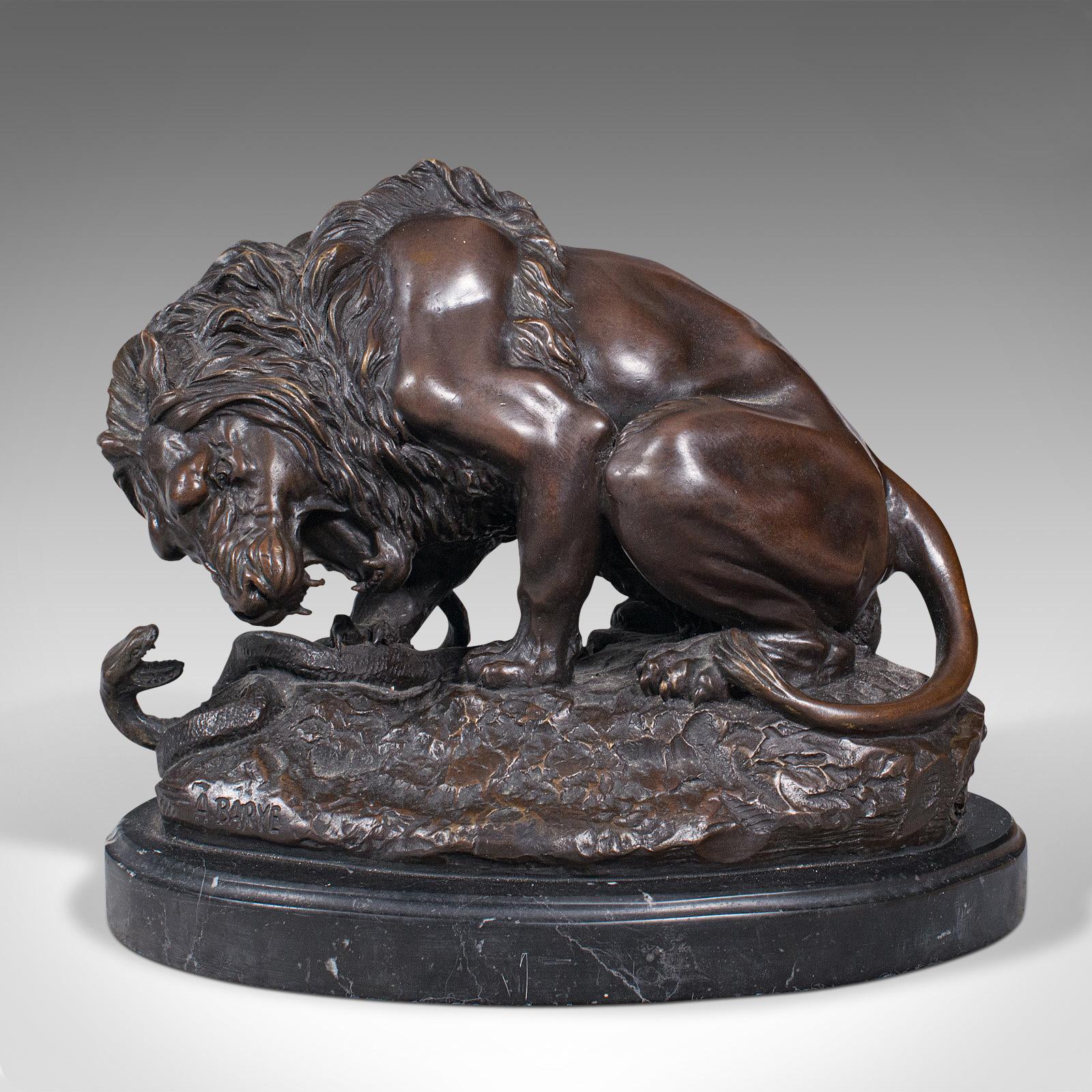 This is a vintage art bronze. A French, fine cast sculpture of a lion and serpent, after Antoine-Louis Barye, dating to the mid 20th century, circa 1950.

In the manner of one of the early 19th century's foremost animalier - or animal sculptor -