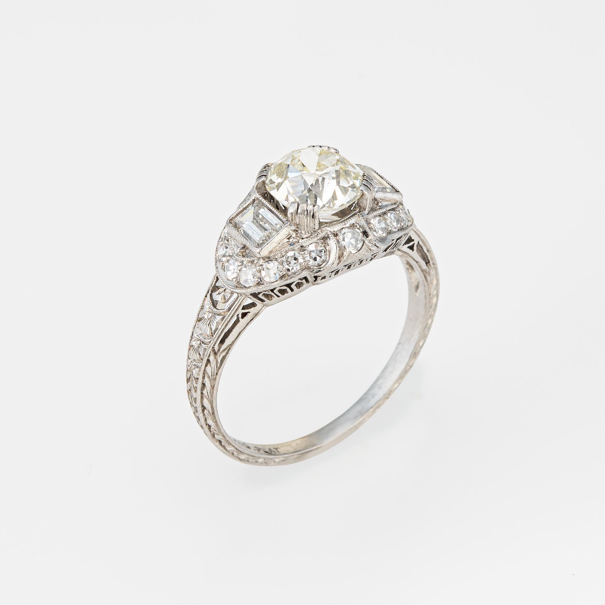 Finely detailed vintage Art Deco 1.35ct old European brilliant cut diamond engagement ring (circa 1920s to 1930s) crafted in platinum. 

Center set old European brilliant cut diamond measures 7.01 x 6.77 x 4.65mm and is estimated at 1.35 carats. The