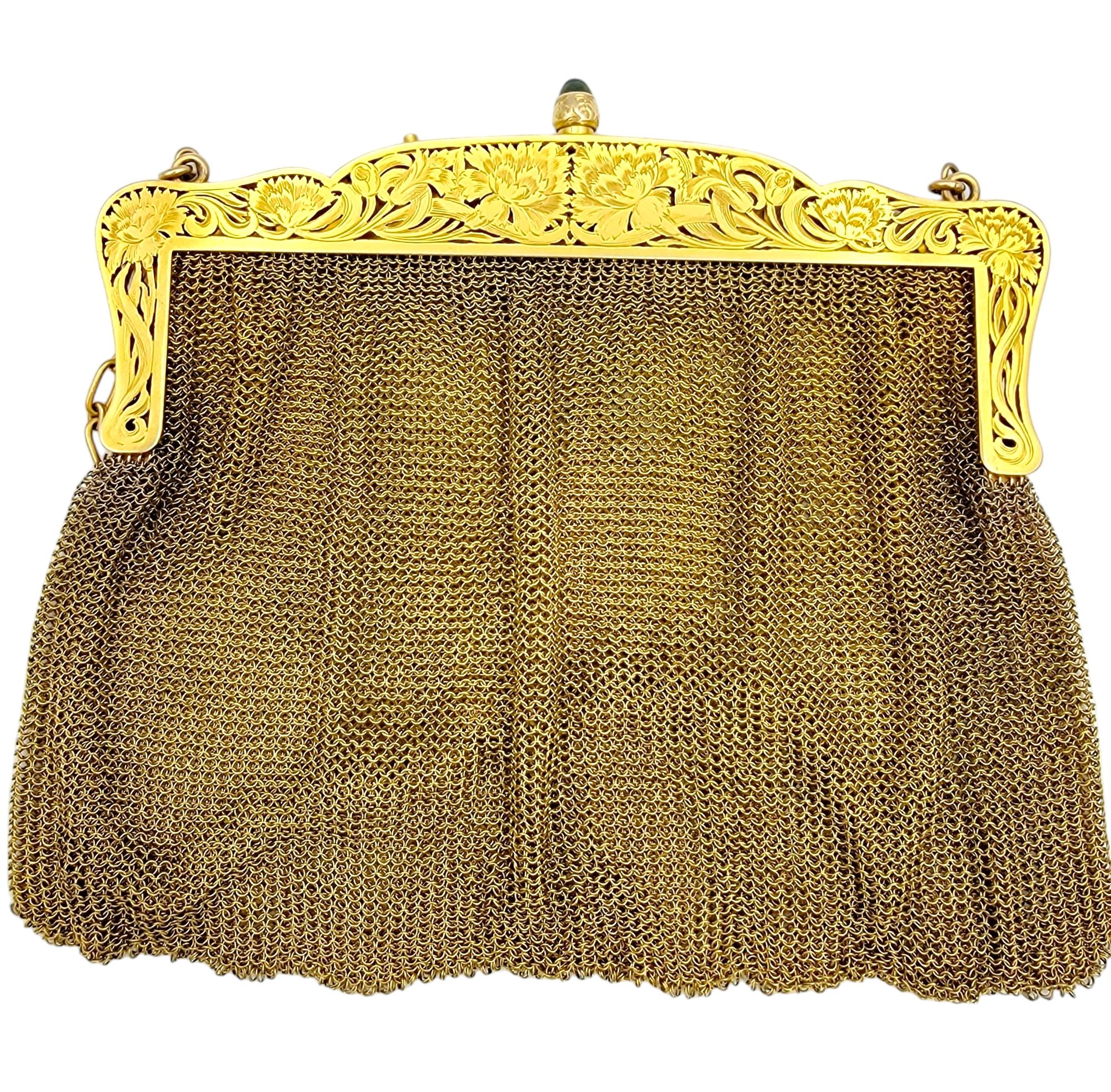 Exquisite 14 karat yellow gold flapper purse. This gorgeous and unique Art Deco piece is composed of delicate woven 14 karat yellow gold mesh accented by a single grayish-blue sapphire cabochon at the kiss lock clasp. The top portion of the purse