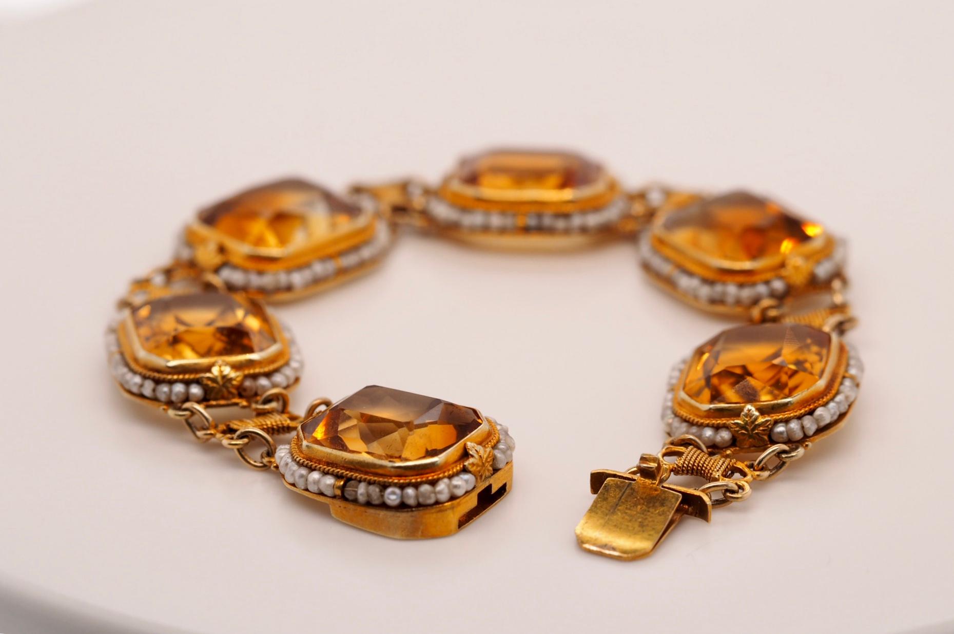 Vintage 14 Karat Yellow Gold  46.62 Carat total weight Citrine Bracelet includes six individually bezel set citrines measuring 14mm x 7mm approximately 7.77 Carats each.  Each stone is surrounded with beautiful detailed wire of pearls average 1 mm