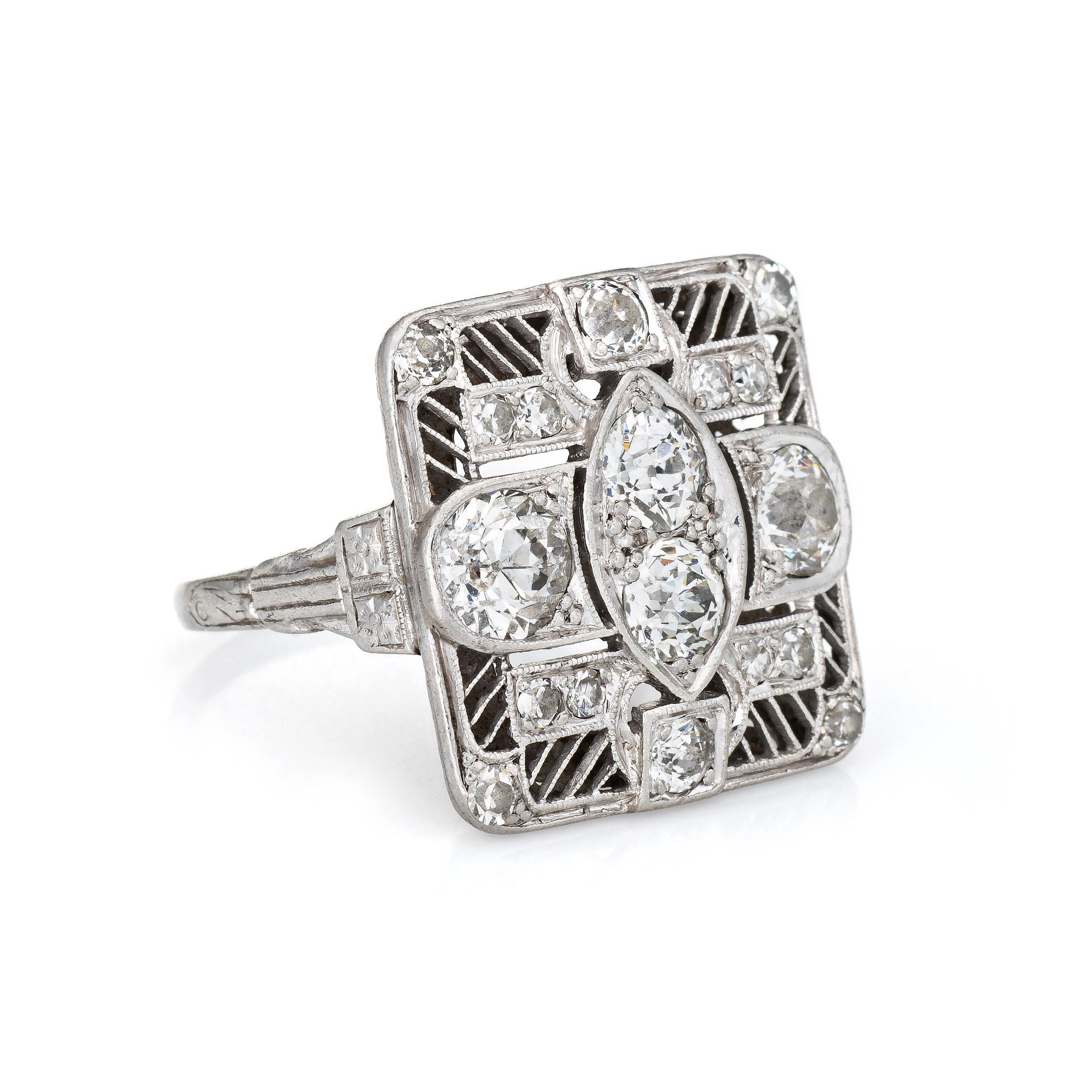 Finely detailed vintage Art Deco era diamond ring (circa 1920s to 1930s) crafted in 900 platinum. 

Old European and single cut diamonds total an estimated 1.50 carats (estimated at I-J color and VS2-SI2 clarity). The four larger old European cut