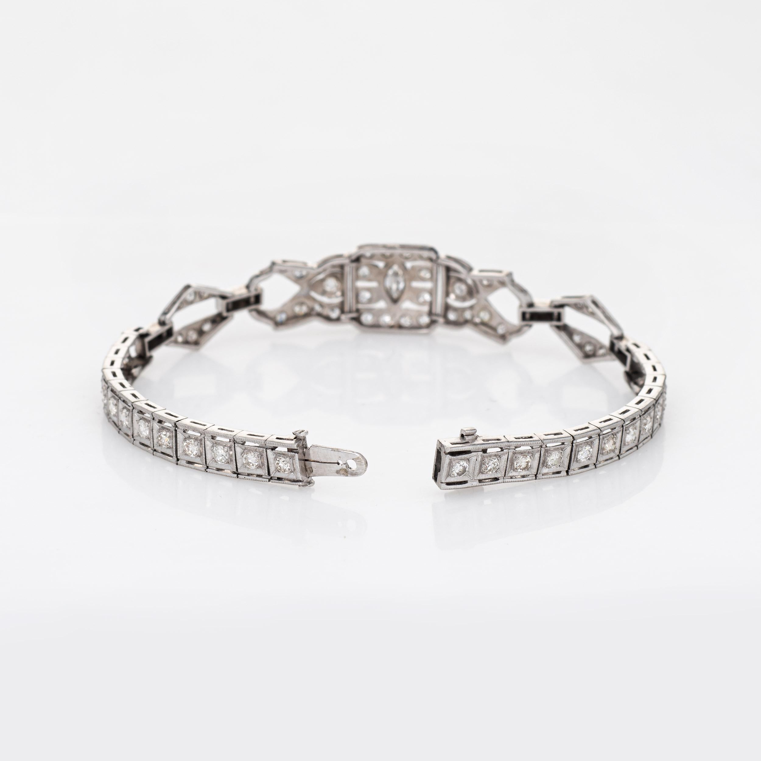 Stylish and elegant vintage Art Deco era bracelet (circa 1920s to 1930s) crafted in 900 platinum. 

Old European cut diamonds and one marquise cut diamond (center) range in size from 0.01 to 0.20 carats. The total diamond weight is estimated at 1.65