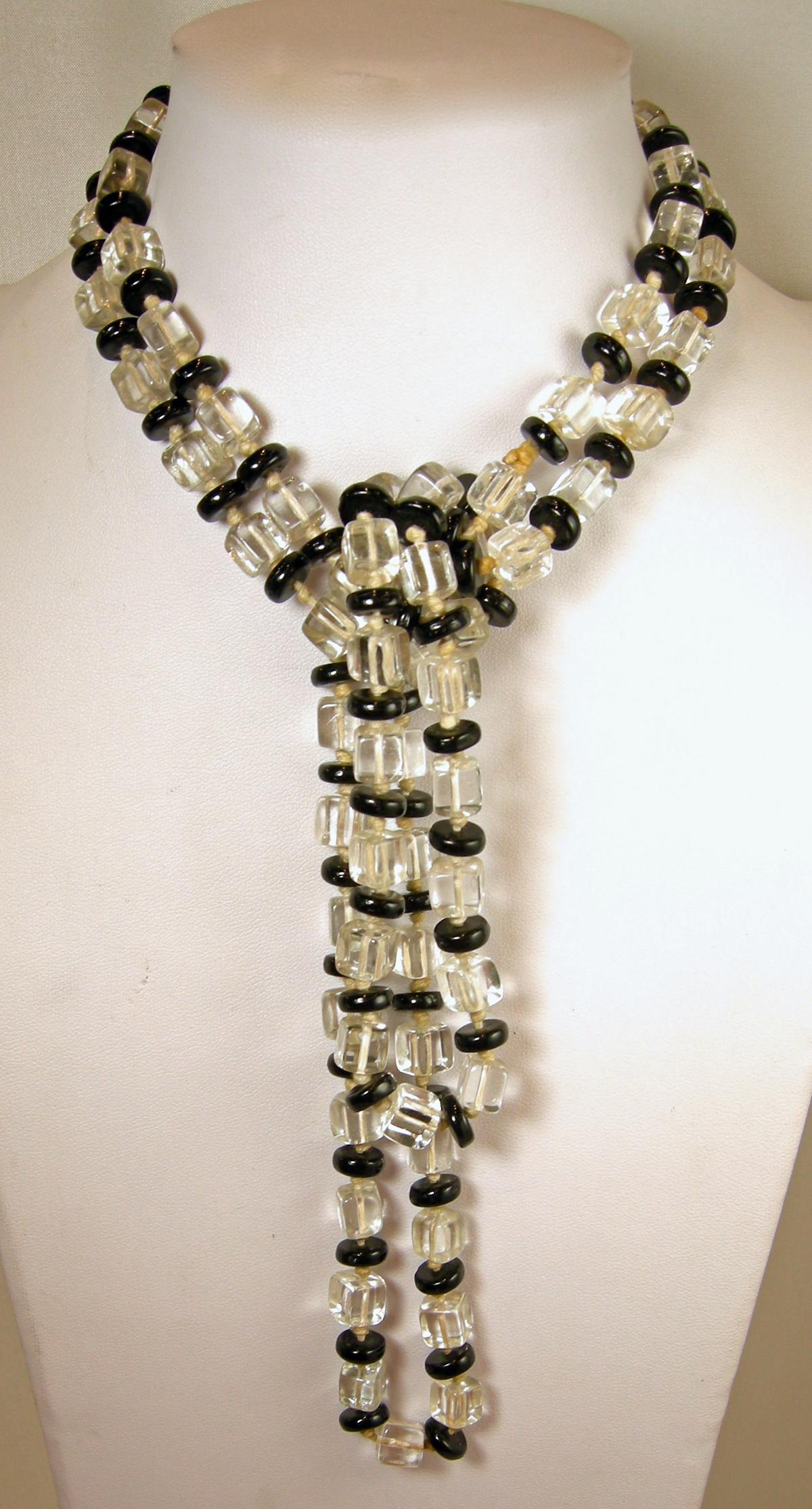 This vintage Art Deco necklace is from the 1920s has black and clear crystal beads that are individually knotted. You can create different ways to wear this necklace, which makes it even more fun to wear.  In excellent condition, this necklace