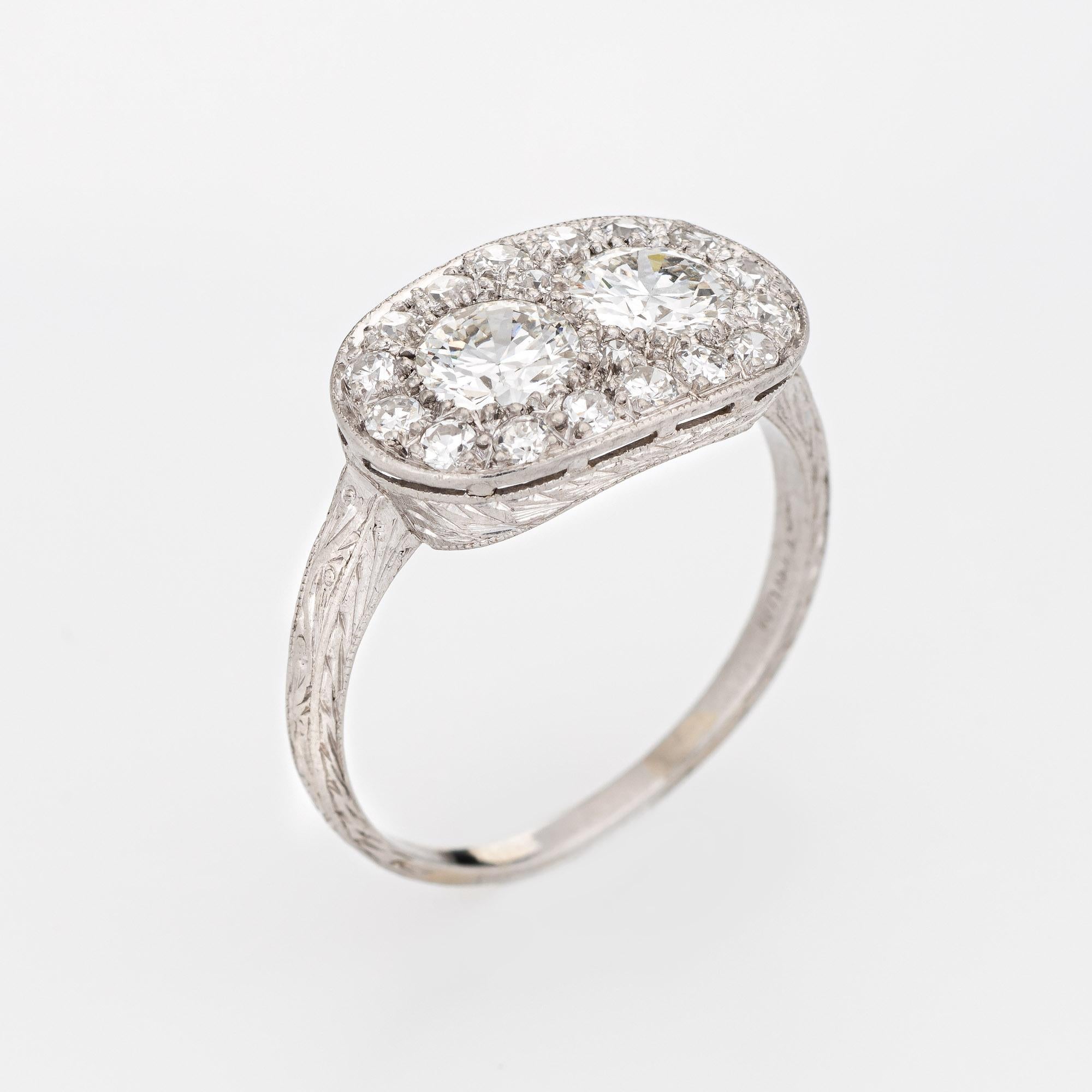 Finely detailed vintage Art Deco era diamond ring (circa 1920s to 1930s) crafted in 900 platinum. 

Two centrally mounted Old European diamonds are estimated at 0.60 carats each, accented with a further 16 single cut diamonds. The total diamond
