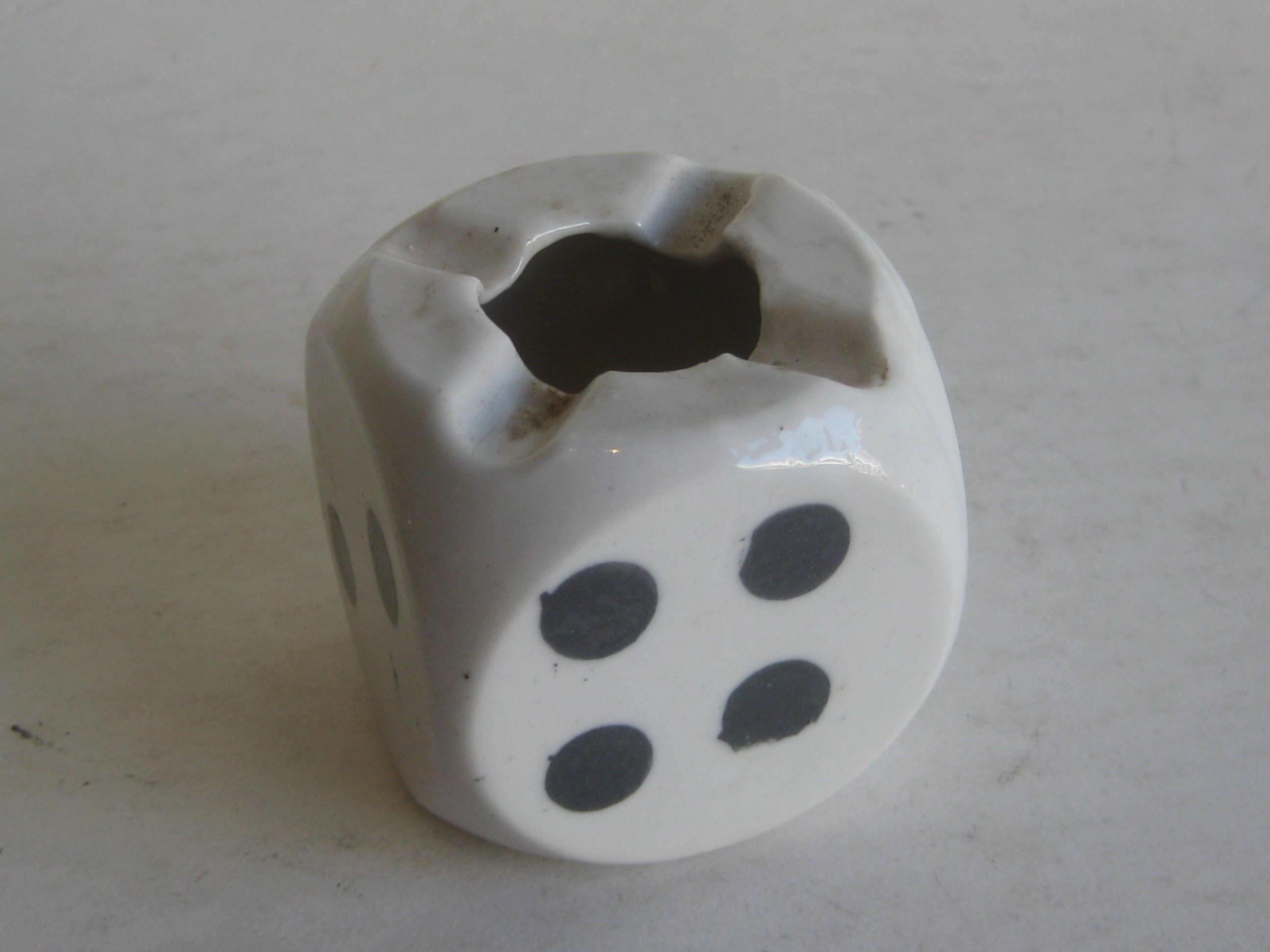 Great vintage Art Deco figural dice ashtray made during the 1930s. Made of porcelain with hand painted accents. Made in Japan and is marked on the bottom edge. In very nice original condition with no chips, no cracks and no repairs. Measures