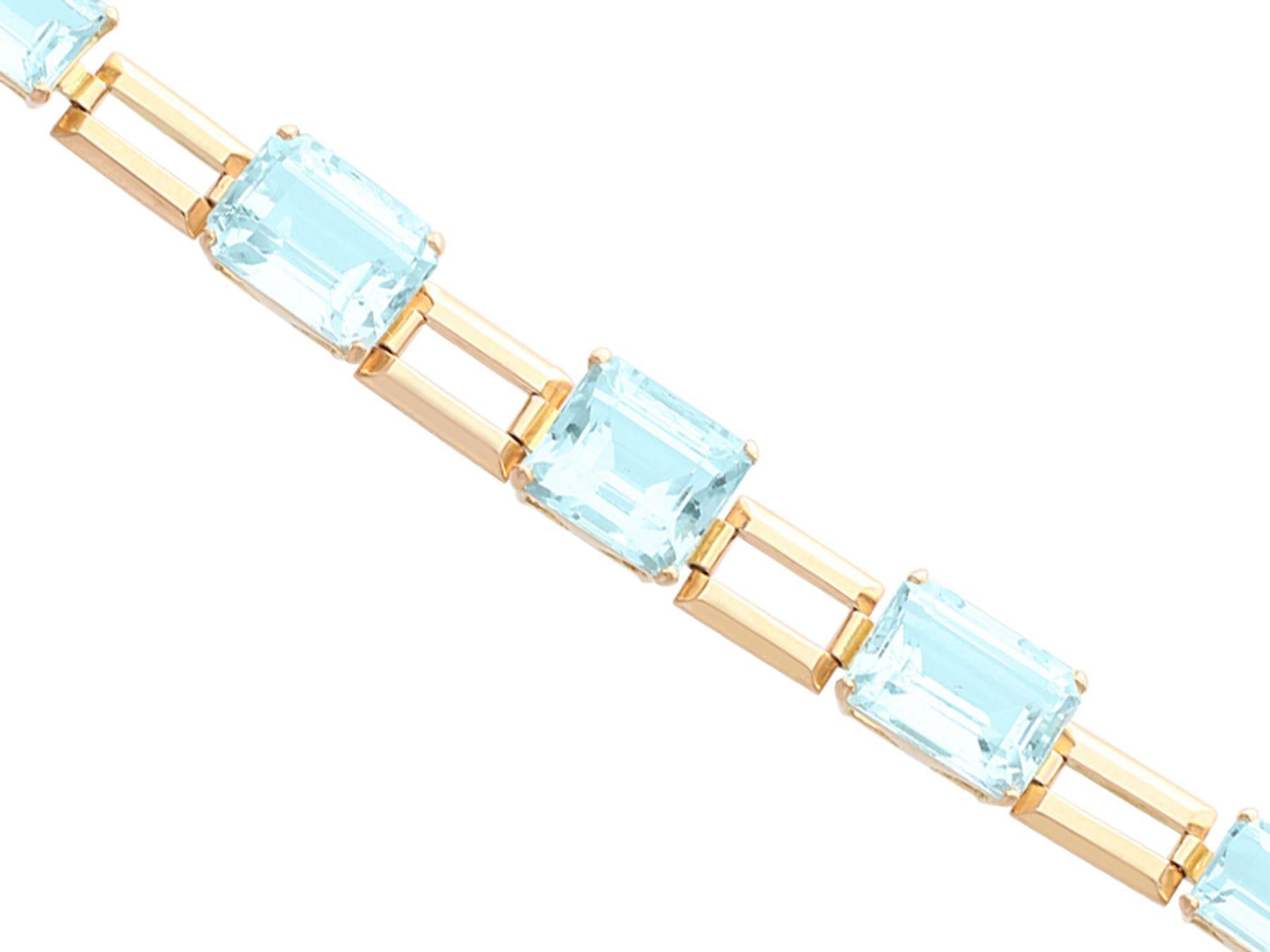 A stunning, fine and impressive vintage Art Deco 39.87 carat aquamarine and 18 karat yellow gold bracelet; part of our diverse antique jewelry and estate jewelry collections.

This stunning, fine and impressive vintage aquamarine bracelet has been