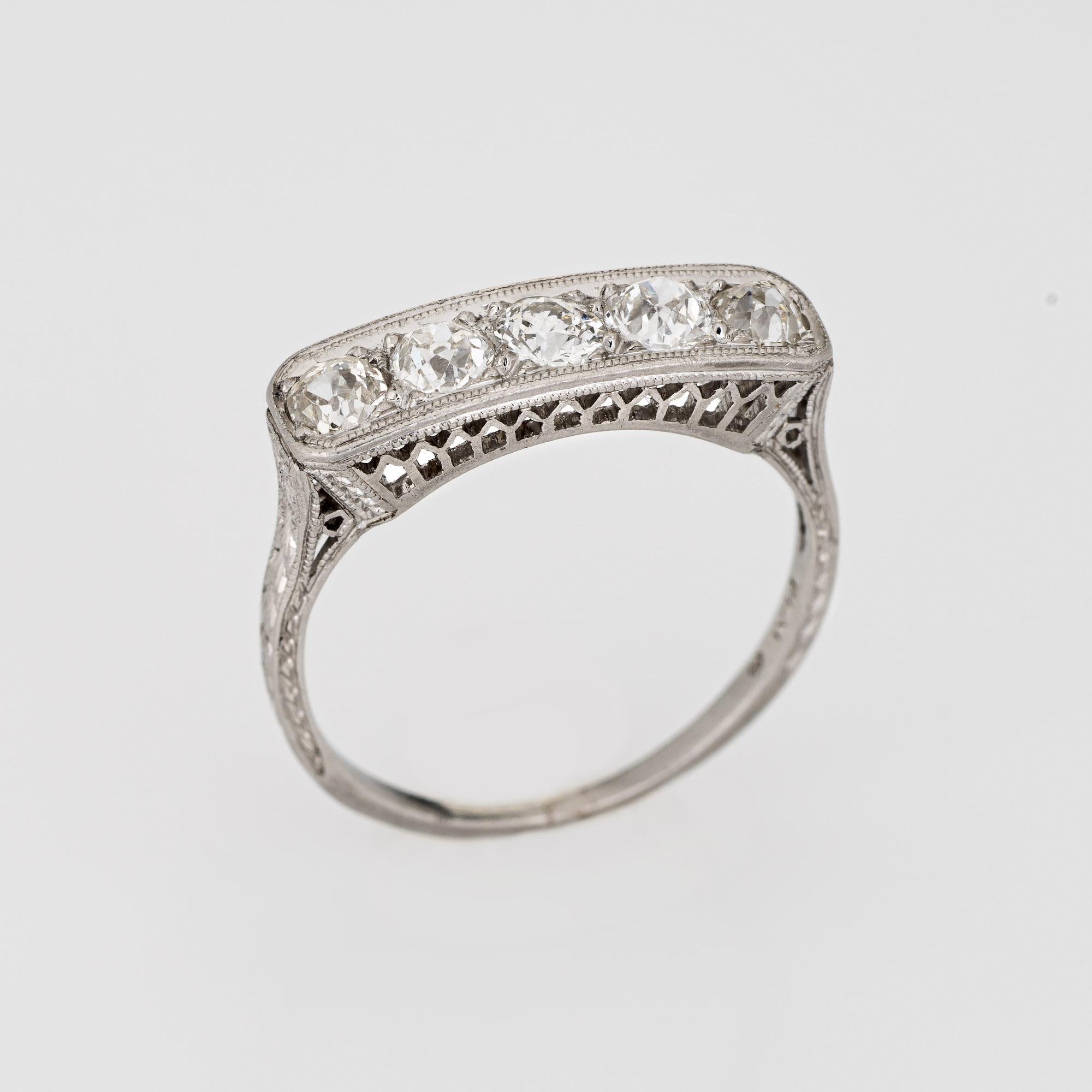Finely detailed vintage Art Deco 5 stone diamond ring (circa 1920s to 1930s) crafted in platinum. 

Five old mine cut diamonds are estimated at 0.15 carats each and total an estimated 0.75 carats (estimated at H-I color and VS2-SI1 clarity). 
