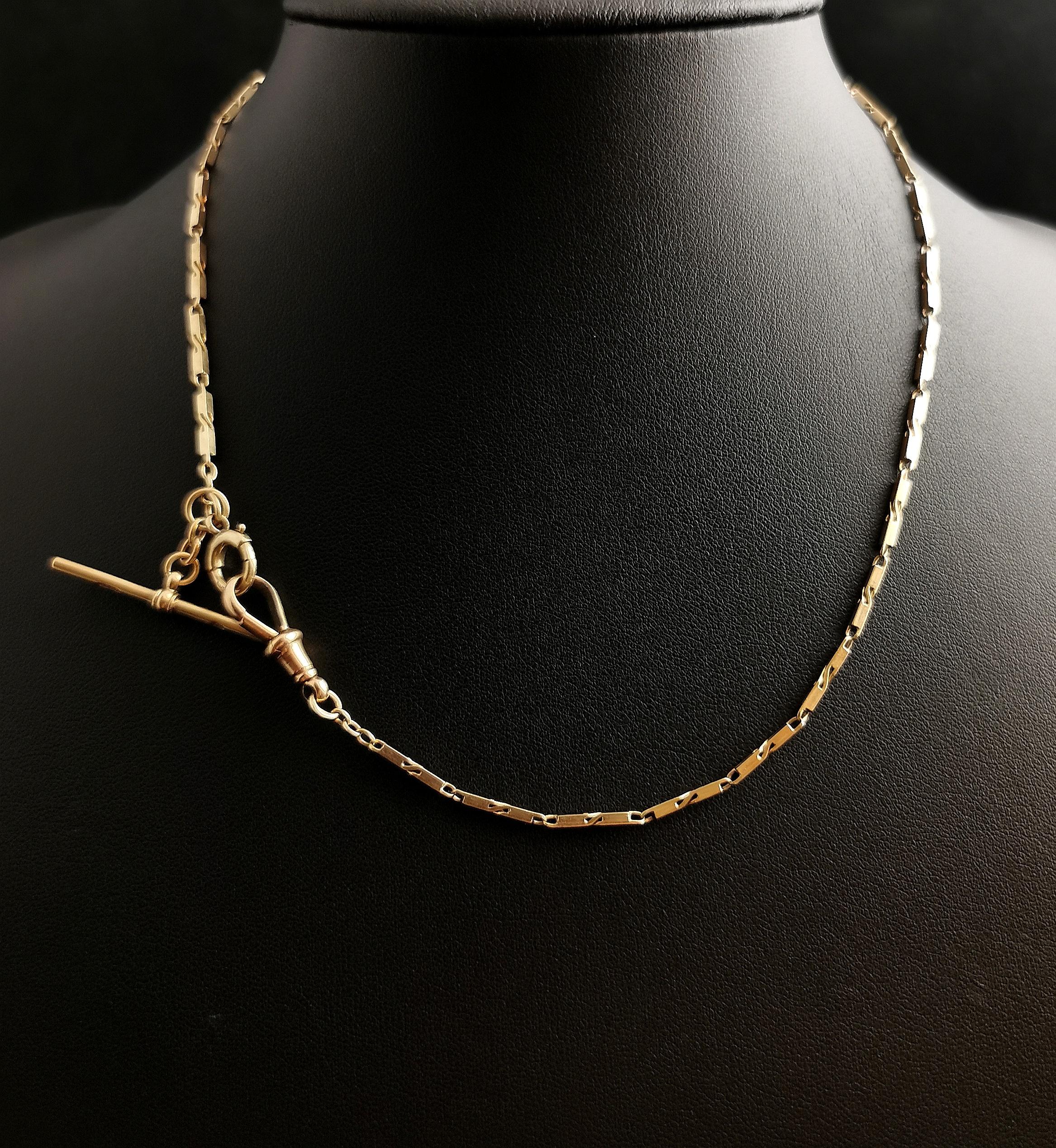 A gorgeous Art Deco 9kt yellow gold fancy bar link watch chain or Albert chain, this is a longer length so could be used as a necklace.

It has fancy bar links with a light twist design at each end in rich yellow, solid gold.

The chain has a 9kt