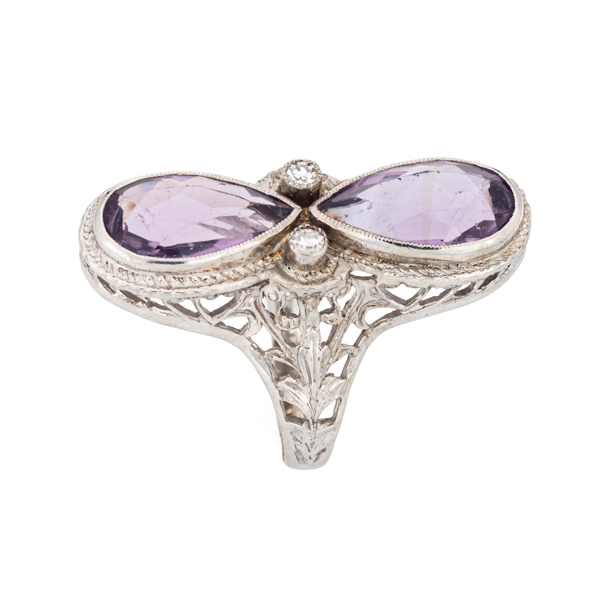 Finely detailed vintage Art Deco elongated amethyst & diamond ring (circa 1920s to 1930s) crafted in 14 karat white gold. 

Pear cut amethysts measure 10mm x 6mm (estimated at 1.25 carats each - 2.50 carats total estimated weight). Two diamonds