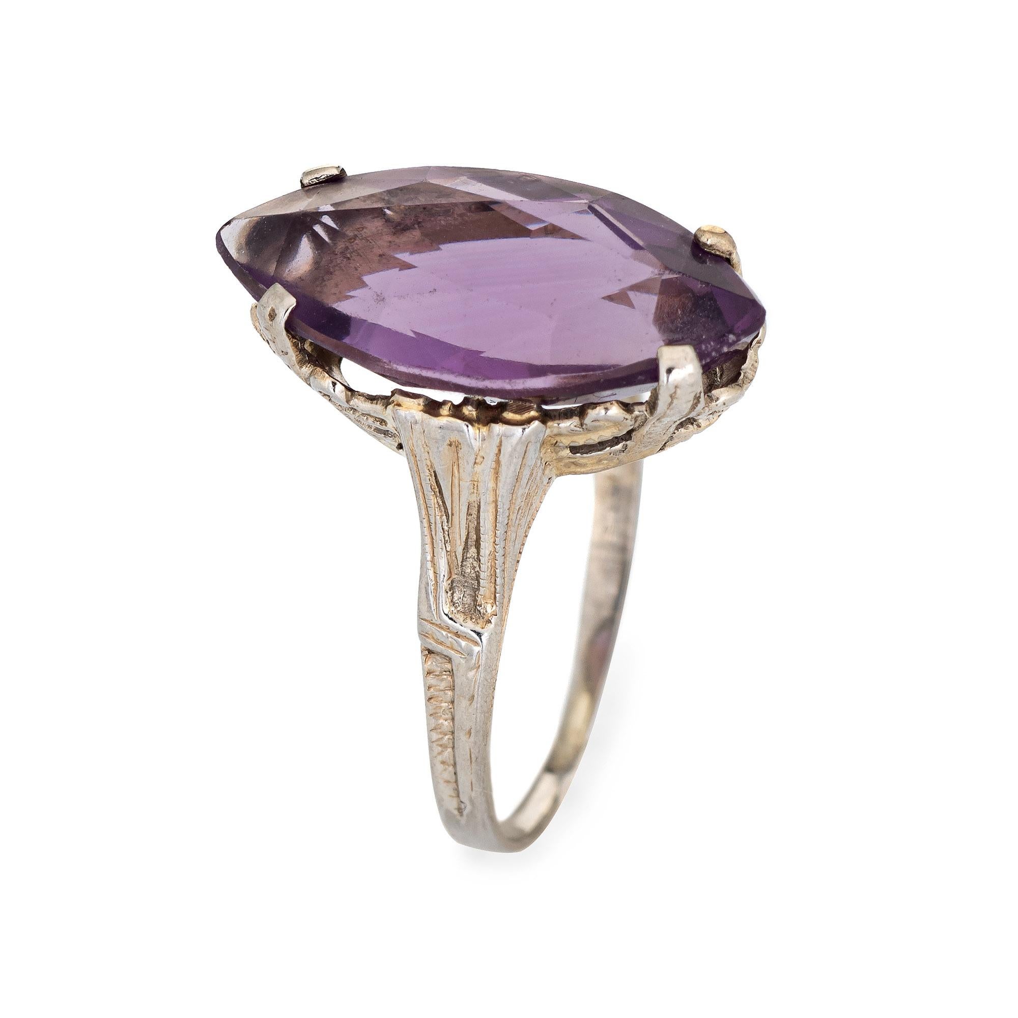 Finely detailed vintage Art Deco amethyst ring (circa 1920s to 1930s) crafted in 18k white gold. 

Marquise cut amethyst measures 18mm x 9mm. Note: few light surface abrasions from wear visible under a 10x loupe).   

The stylish Art Deco era ring