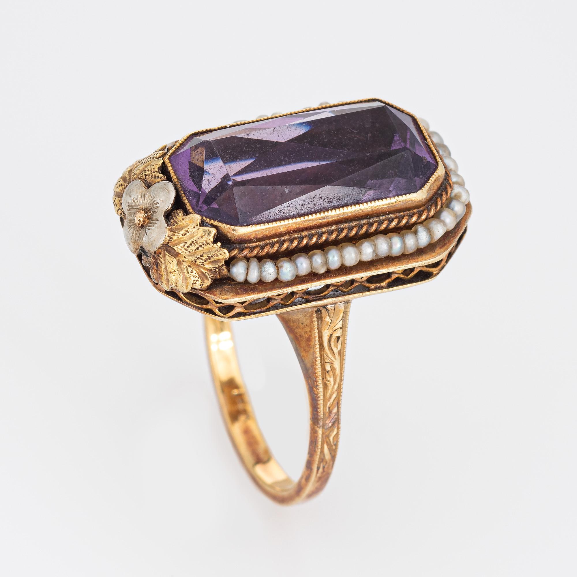Finely detailed vintage Art Deco amethyst & seed pearl ring (circa 1920s to 1930s) crafted in 14k yellow gold. 

Amethyst measures 16mm x 8mm (estimated at 6 carats). Note: few light surface abrasions to the amethyst. The seed pearls are approx. 1mm