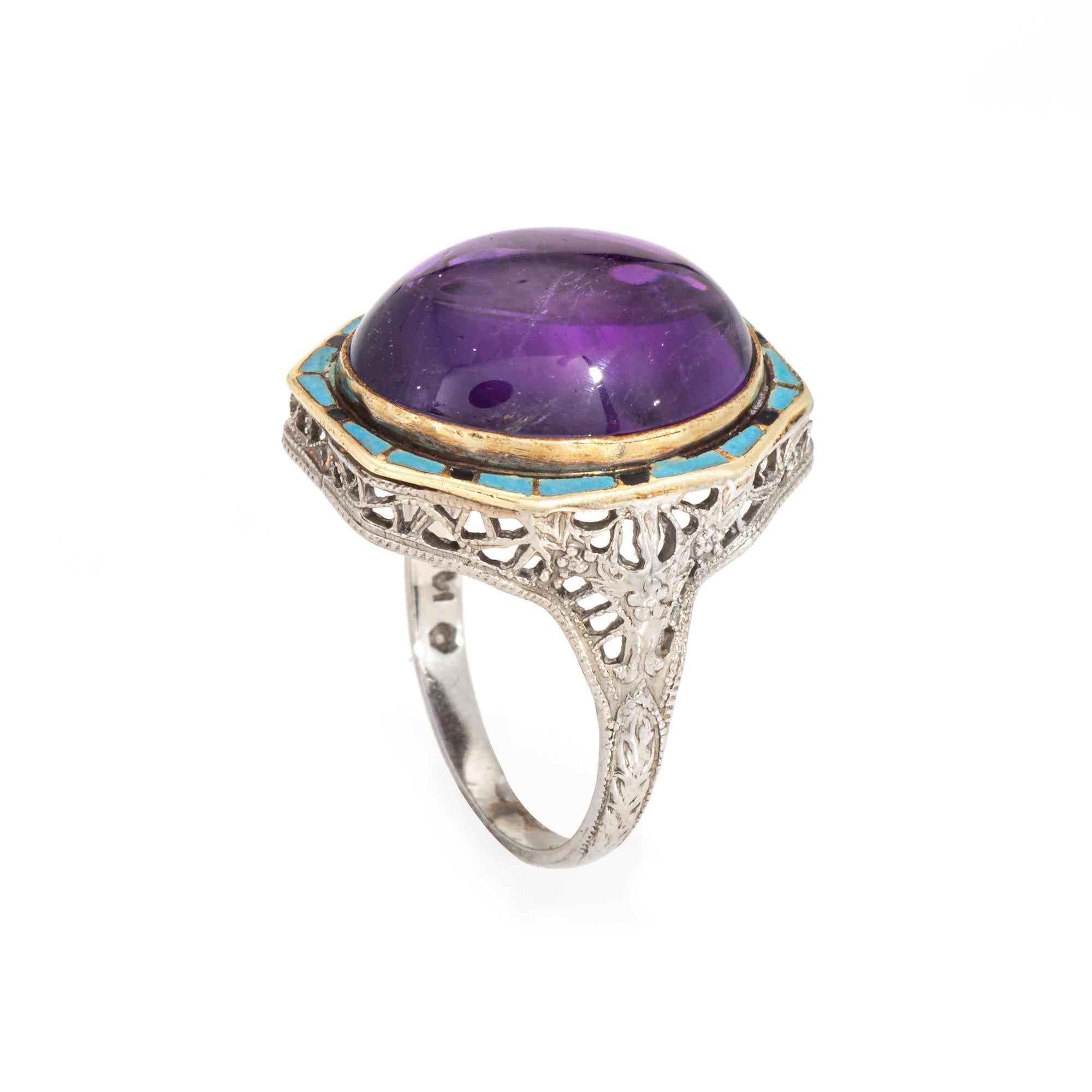 Vintage Art Deco era amethyst & enamel cocktail ring (circa 1930s) crafted in 14 karat white gold.

Cabochon cut amethyst measures 16.5mm x 12.5mm. Black and turquoise blue enamel frame the amethyst and add a beautiful pop of color to the ring. The