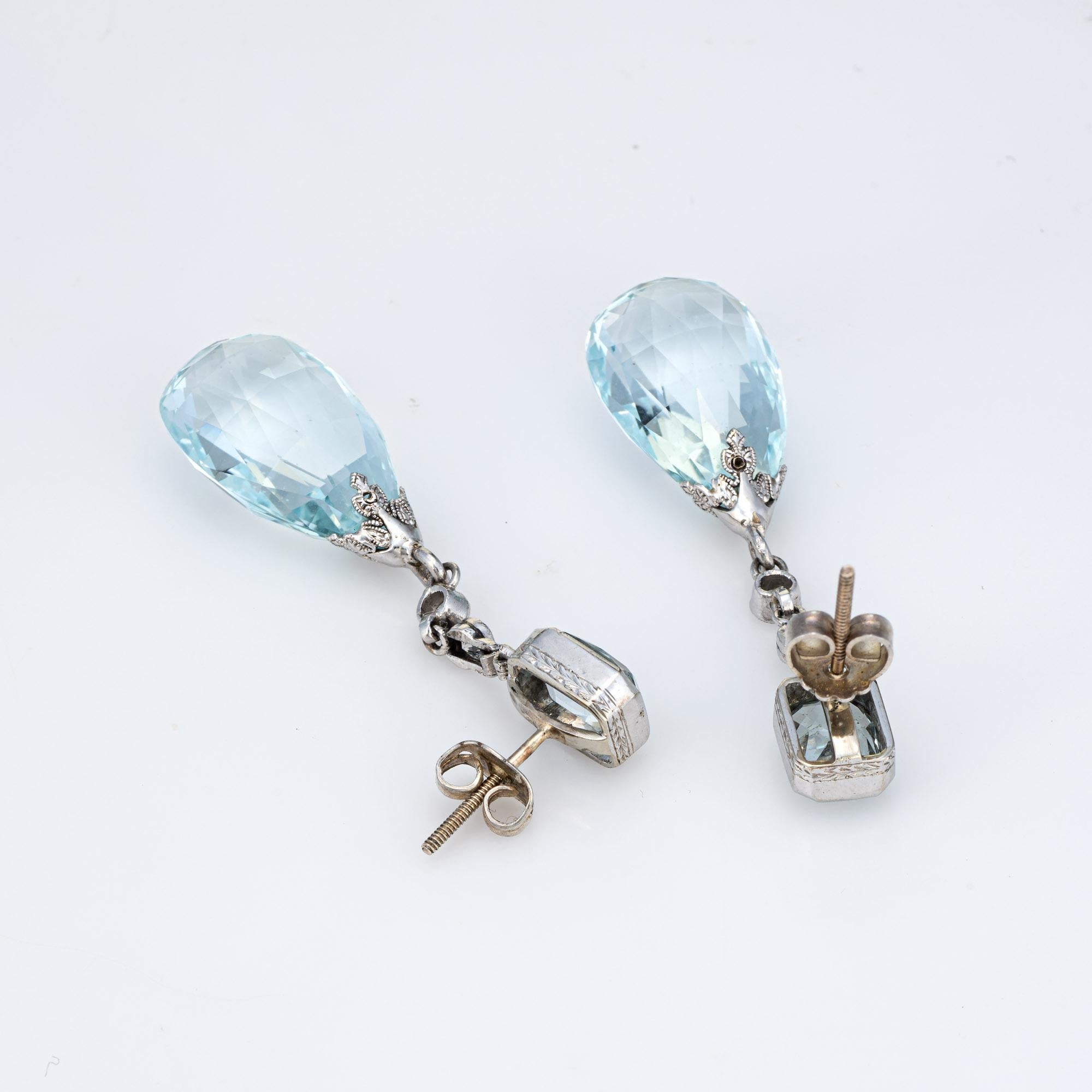Elegant pair of vintage Art Deco era aquamarine & diamond earrings (circa 1920s to 1930s) crafted in 900 platinum. 

Briolette faceted aquamarines measure 18mm x 12mm (lower) and square cushion cut aquamarines measure 7mm x 5mm. Four old European