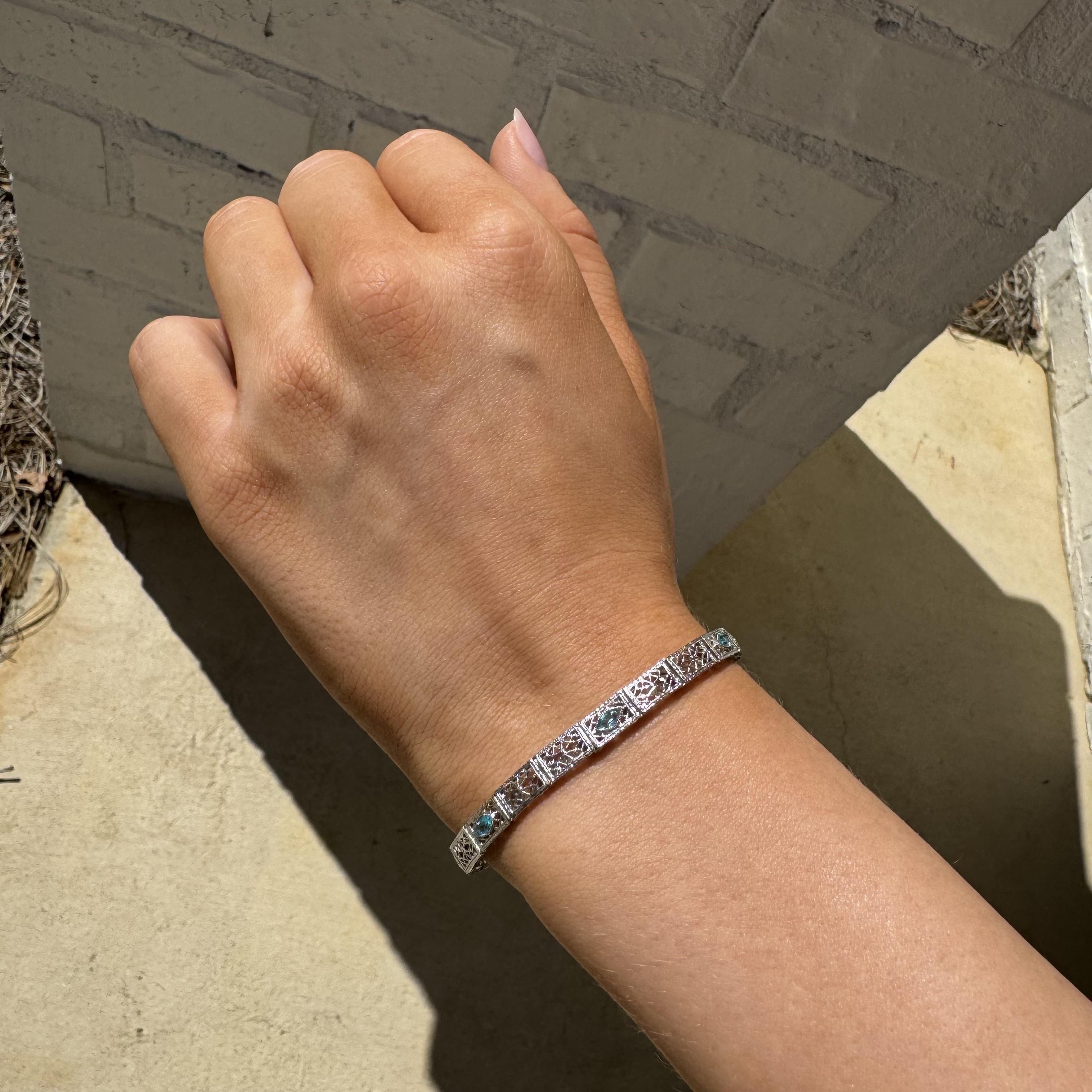 We rarely see aquamarine gemstones in these vintage bracelets!

Bracelet Details
Material: 10K White Gold
Era: Art Dec 1920 - 1940
Width: 4.7mm
Weight: 5.3 Grams
Length: 7 Inches

Accented by the following gemstones
3 - 5mm X 3mm Marquise Cut