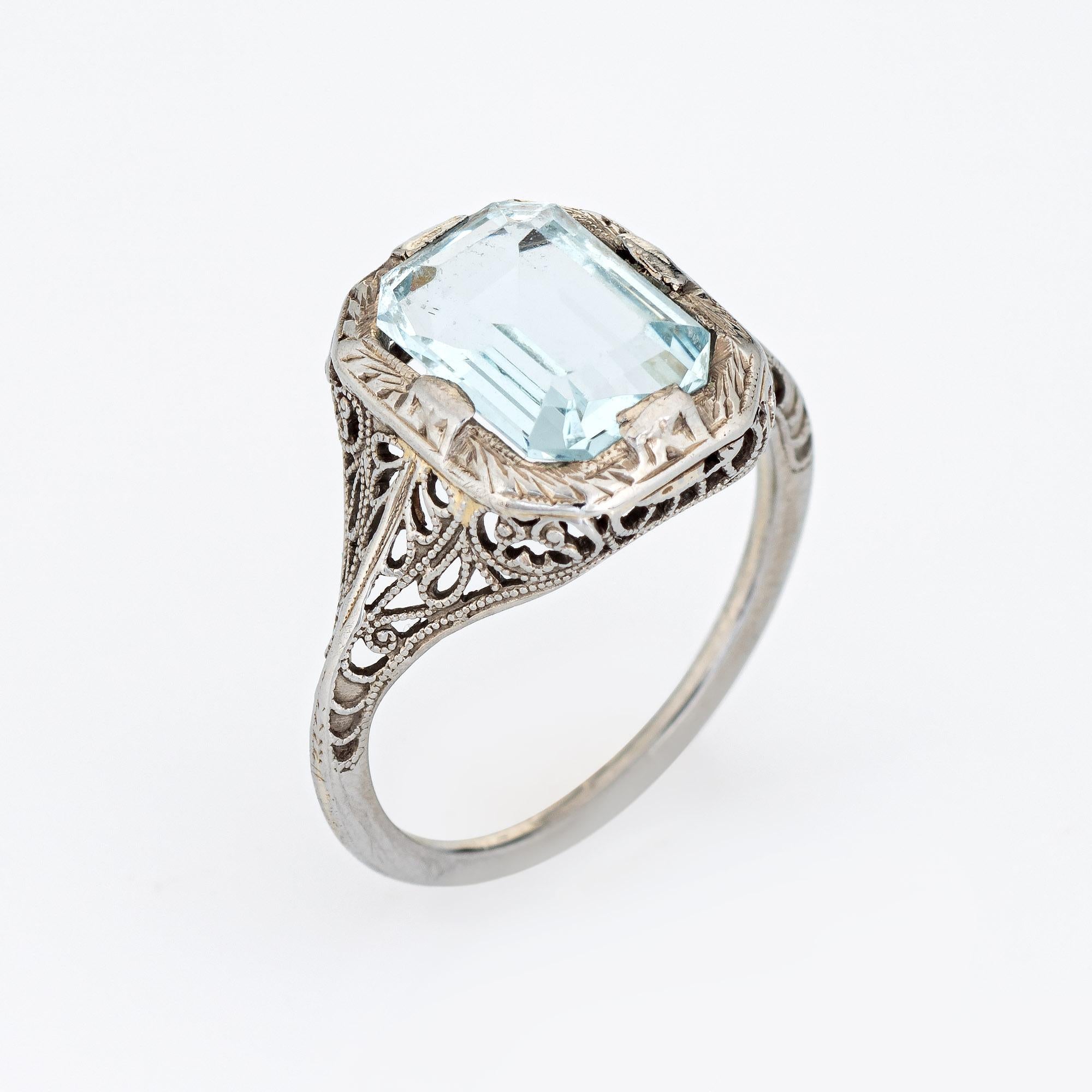 Finely detailed vintage Art Deco aquamarine filigree ring (circa 1920s to 1930s) crafted in 18 karat white gold. 

Aquamarine measures 10mm x 7mm (estimated at 2 carats). The aquamarine is in good condition with minor wear evident under a 10x loupe.