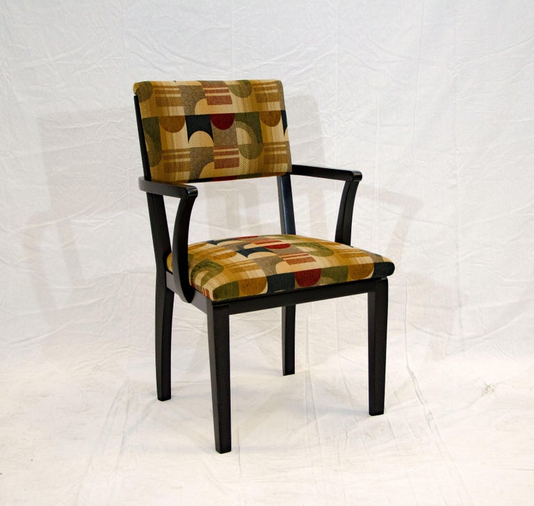 Vintage occasional armchair designed by Donald Deskey and manufactured by Hastings Furniture Co. This single chair frame has a black lacquer finish and has been reupholstered in a new Art Deco pattern fabric. Would be great as an accent chair in any