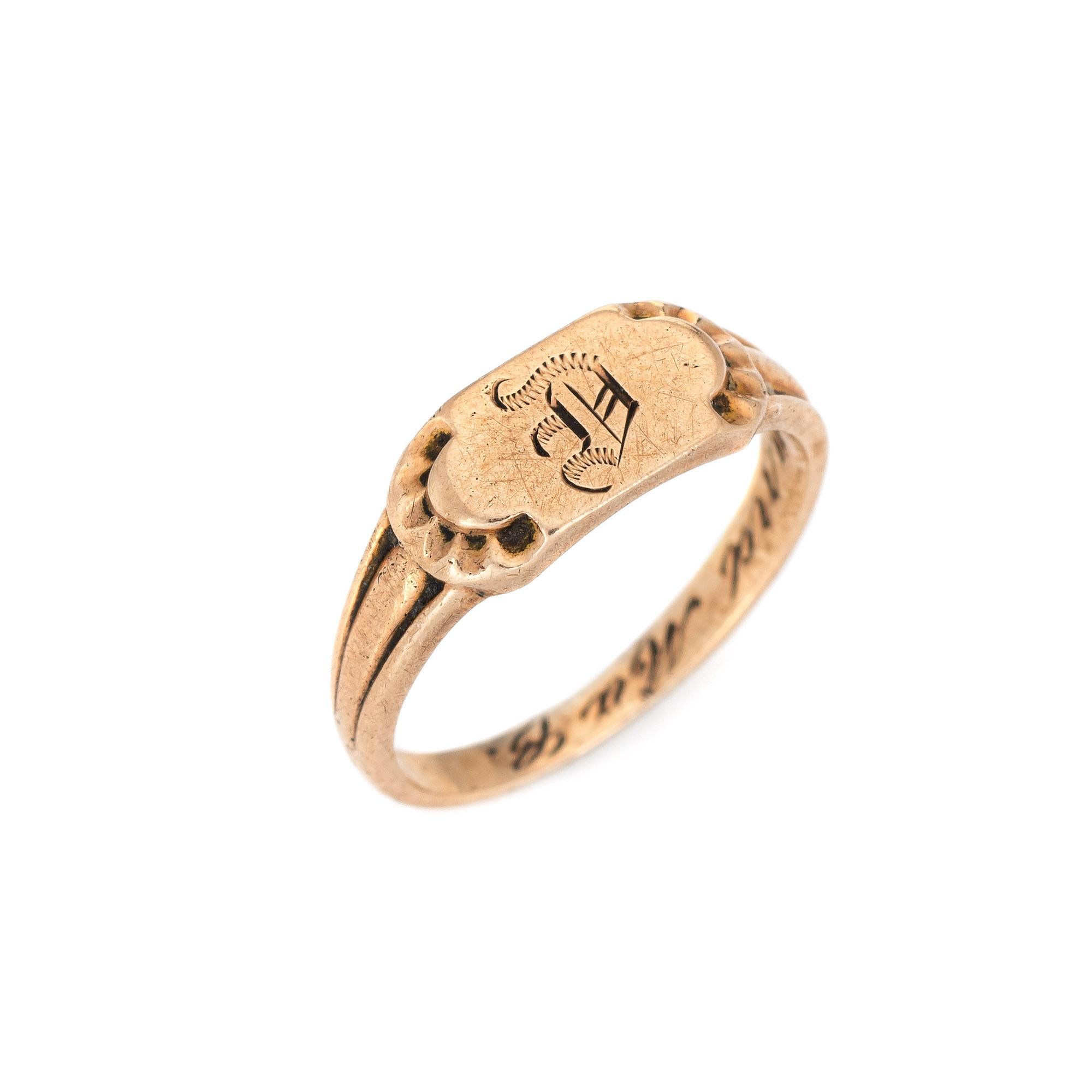 Finely detailed vintage Art Deco baby ring (circa 1920s to 1930s) crafted in 10k rose gold. 

The sweet Art Deco era baby signet ring is engraved with the letter 'D' in old cursive font. The side shoulders feature scalloped detail with the inner